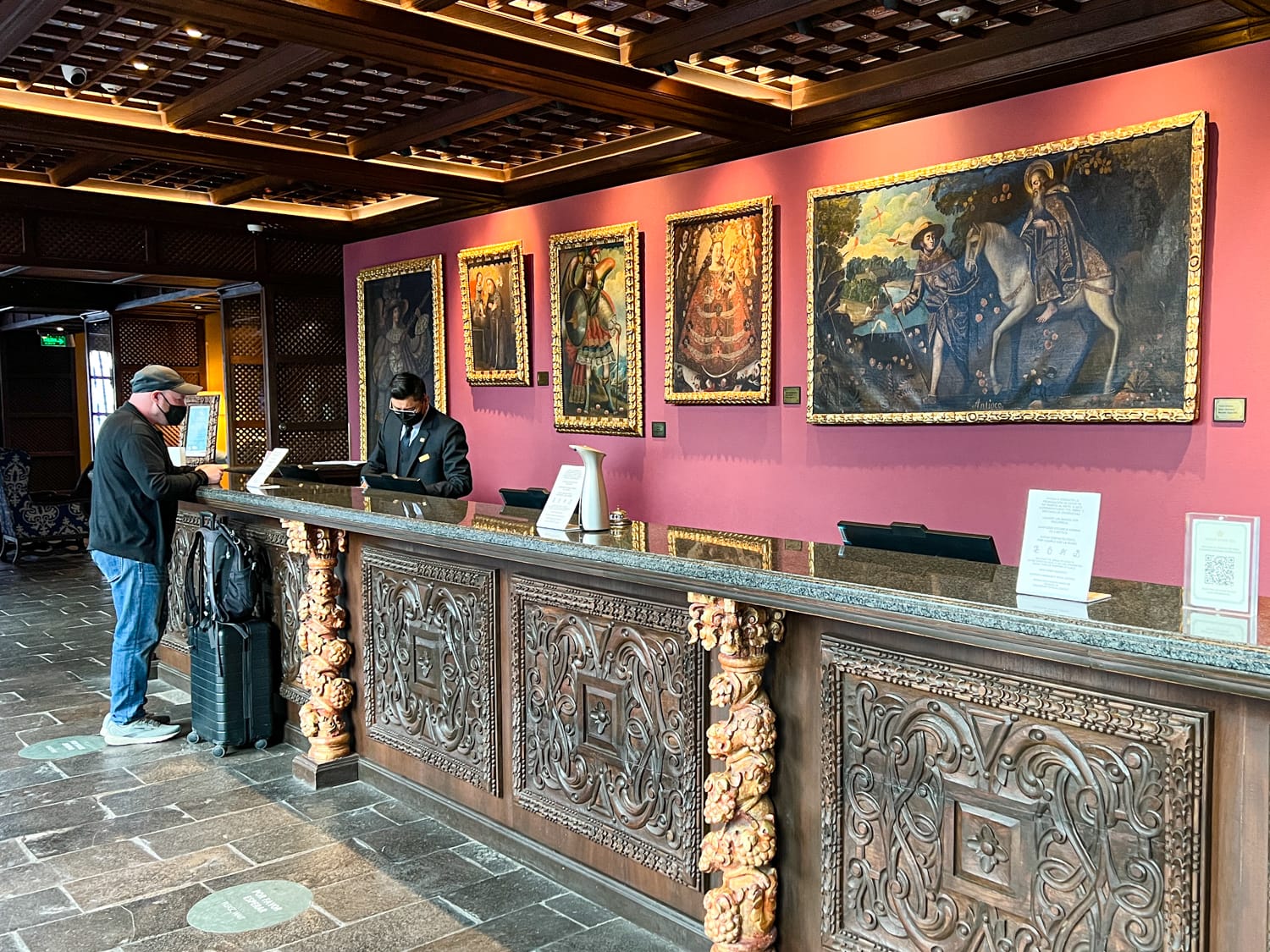 Dave checking in Palacio del Inka's reception desk (photo by Kelly Lemons)