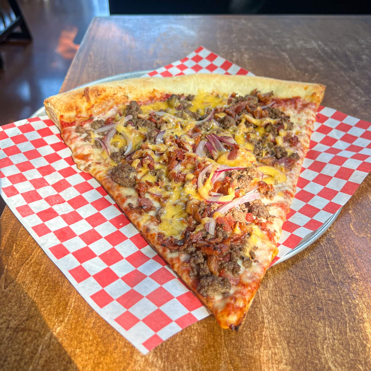 Royale with cheese pizza slice at one of the best restaurants in Georgetown, TX