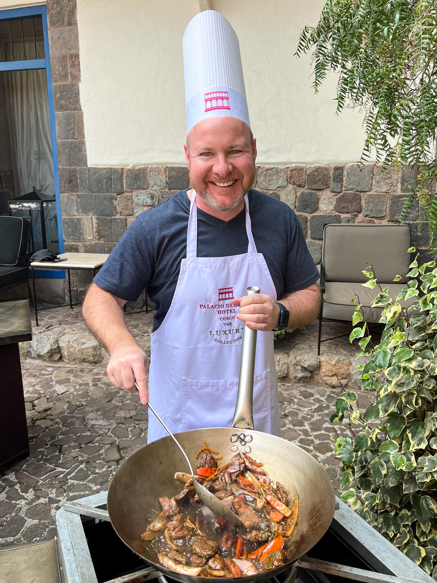 Cooking lomo saltado in a wok at Palacio del Inka hotel in Cusco, Peru