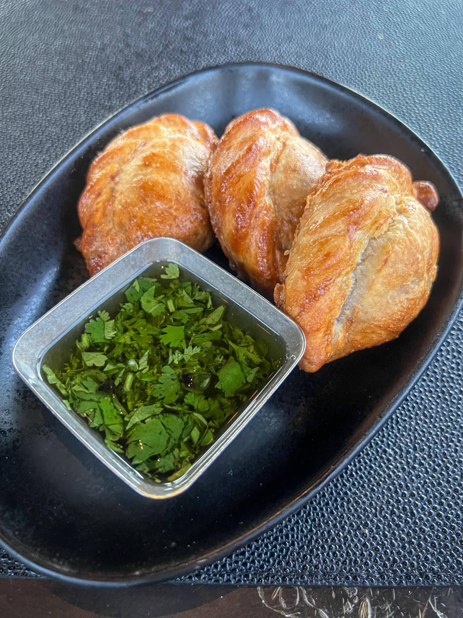 Handmade empanadas with chimichurri sauce