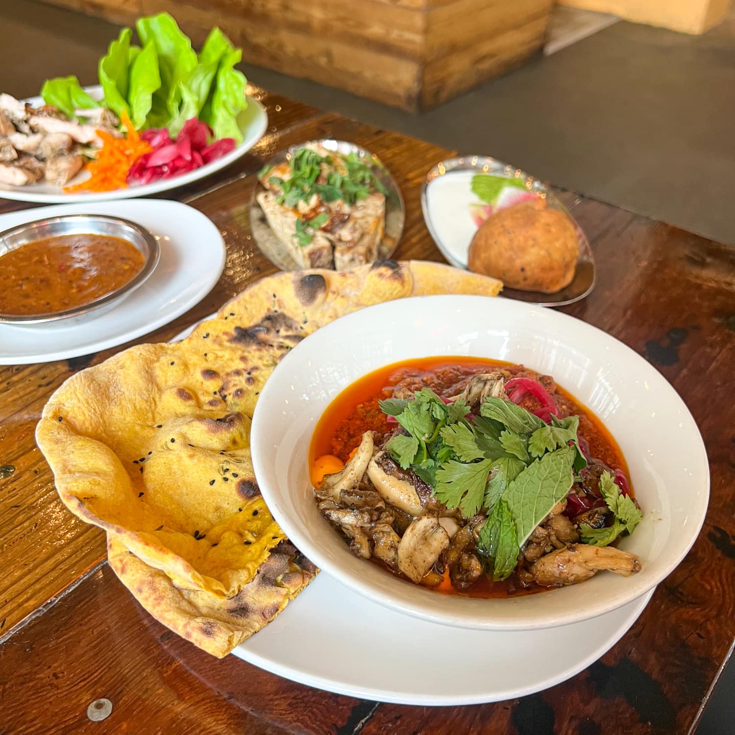 Lamb keema, minced lamb meat in a tomato cardamom yogurt masala with wild mushrooms and naan at Pondicheri in Houston, TX