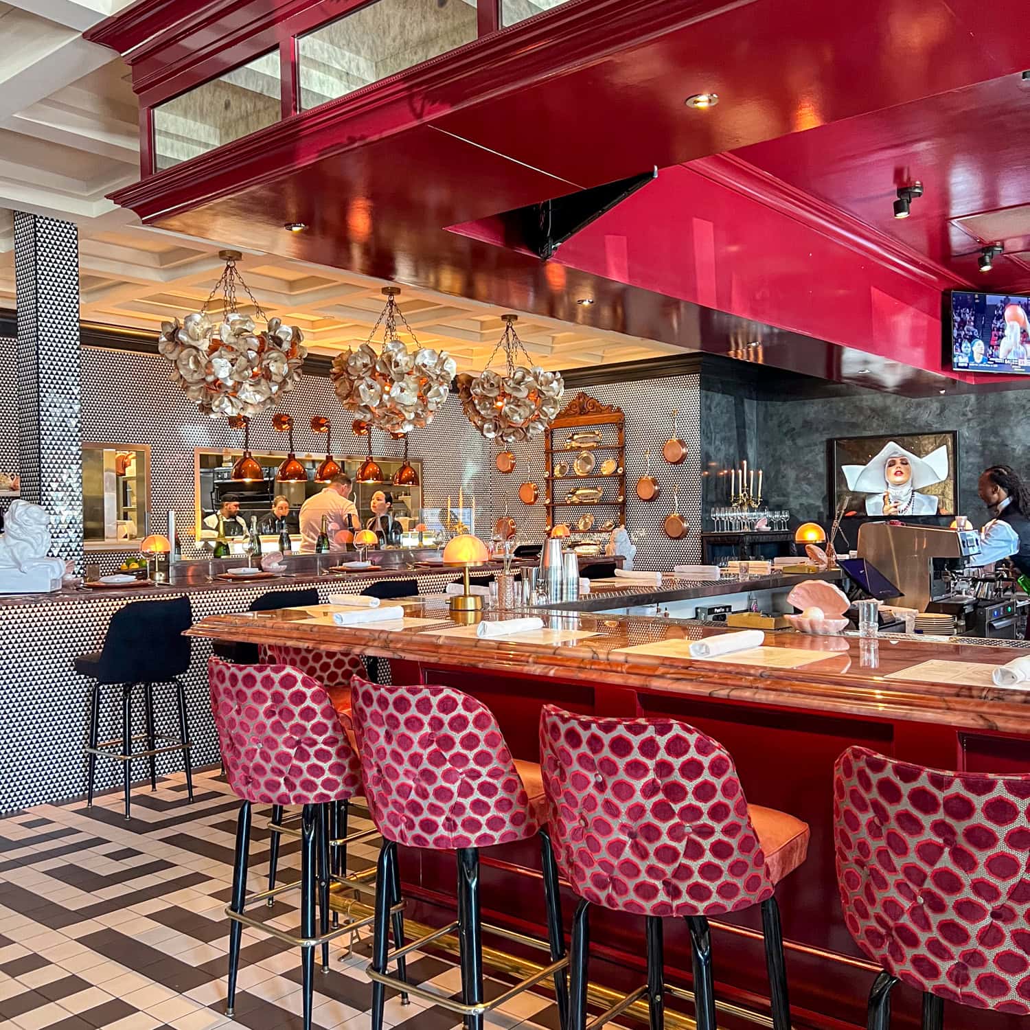 The bar and open kitchen at Le Margot restaurant.