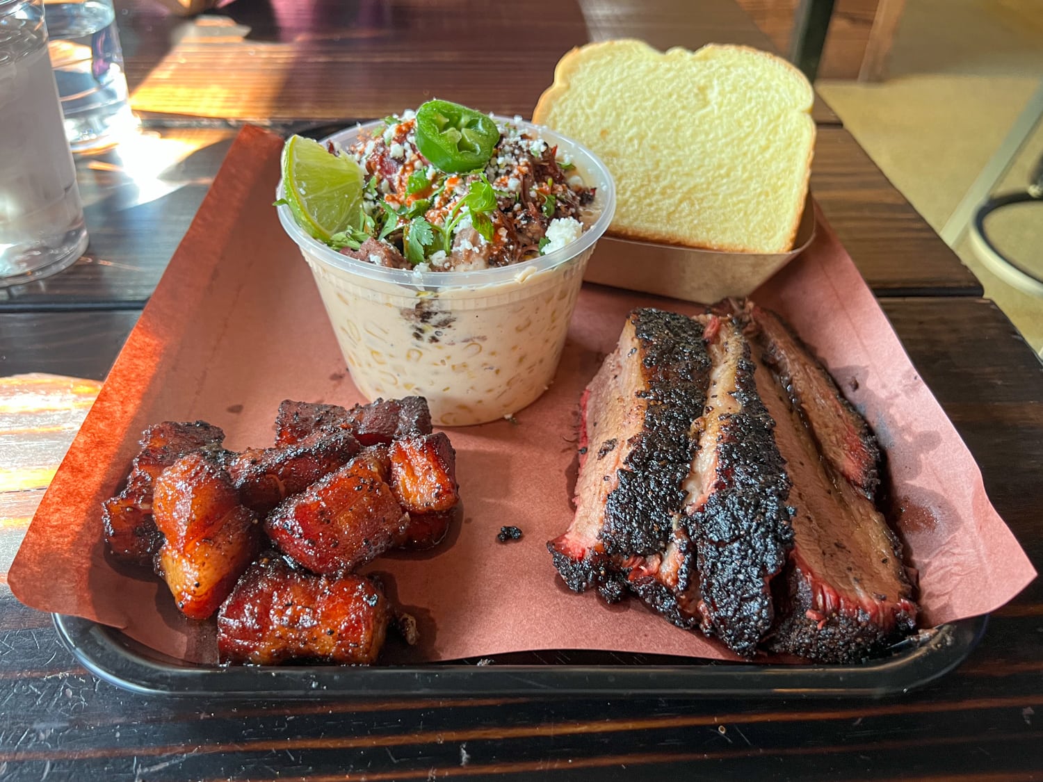 Brisket, pork belly, and elote with brisket at Panther City BBQ