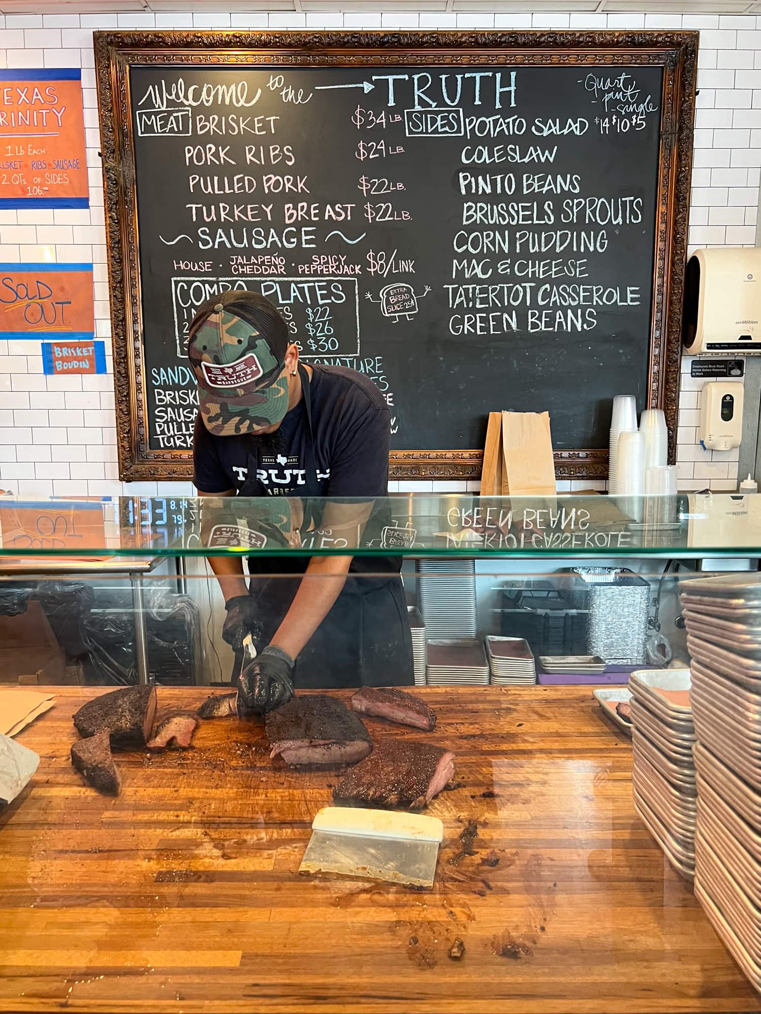 Slicing brisket at Truth Barbeque in Houston, TX