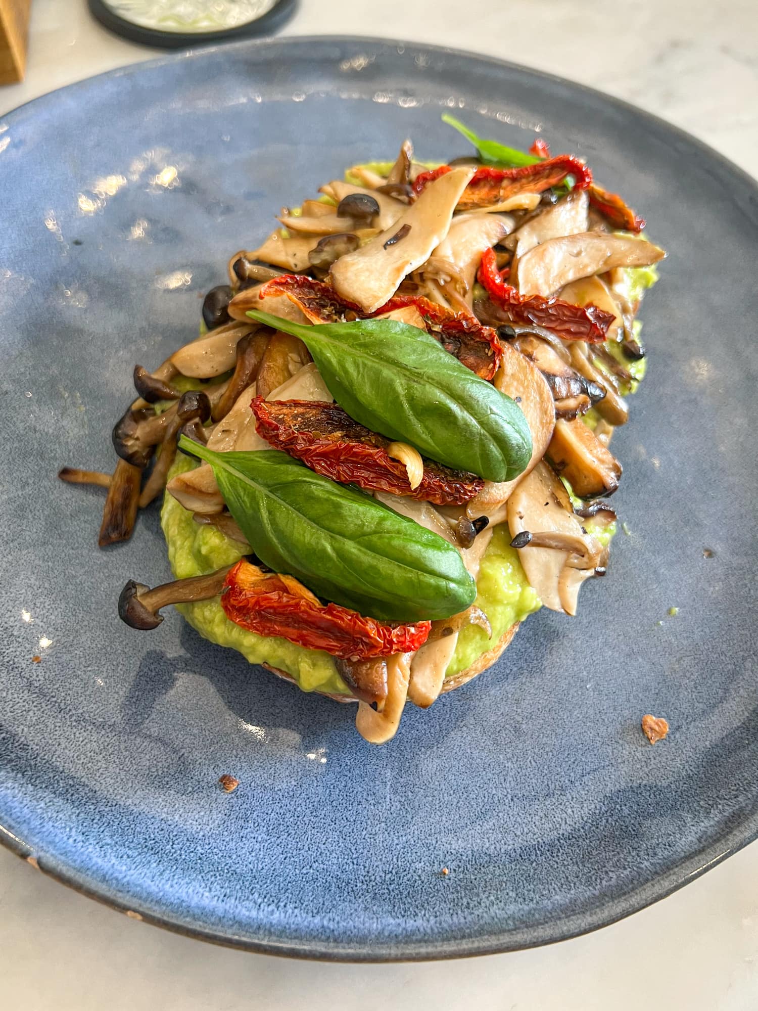 Smashed avocado toast with mushrooms and semi-dried tomatoes at The Vintage Emporium