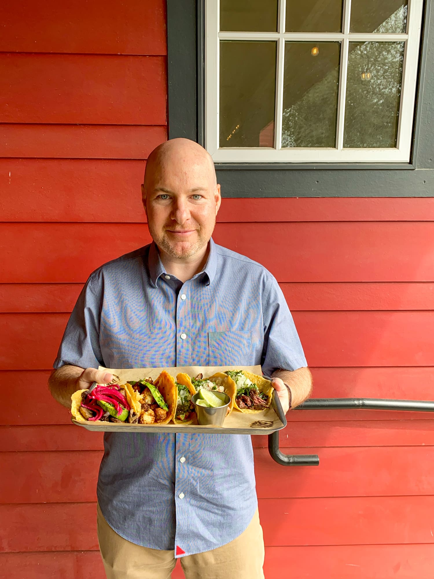 The author with a tray of tacos (photo: Amy Drohen)