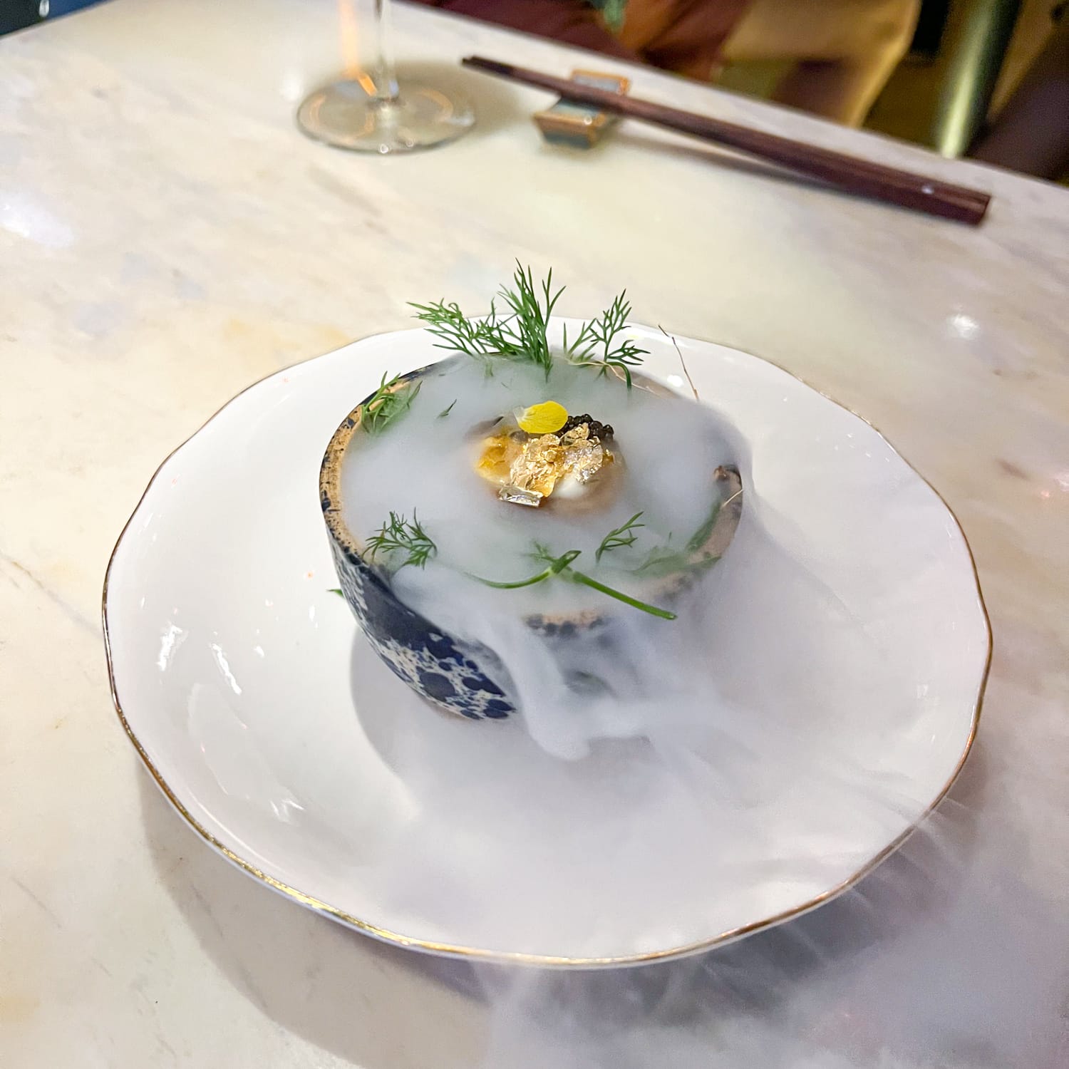 Smoked caviar egg, an amuse bouche on the Chef's Menu at Anan Saigon in Vietnam