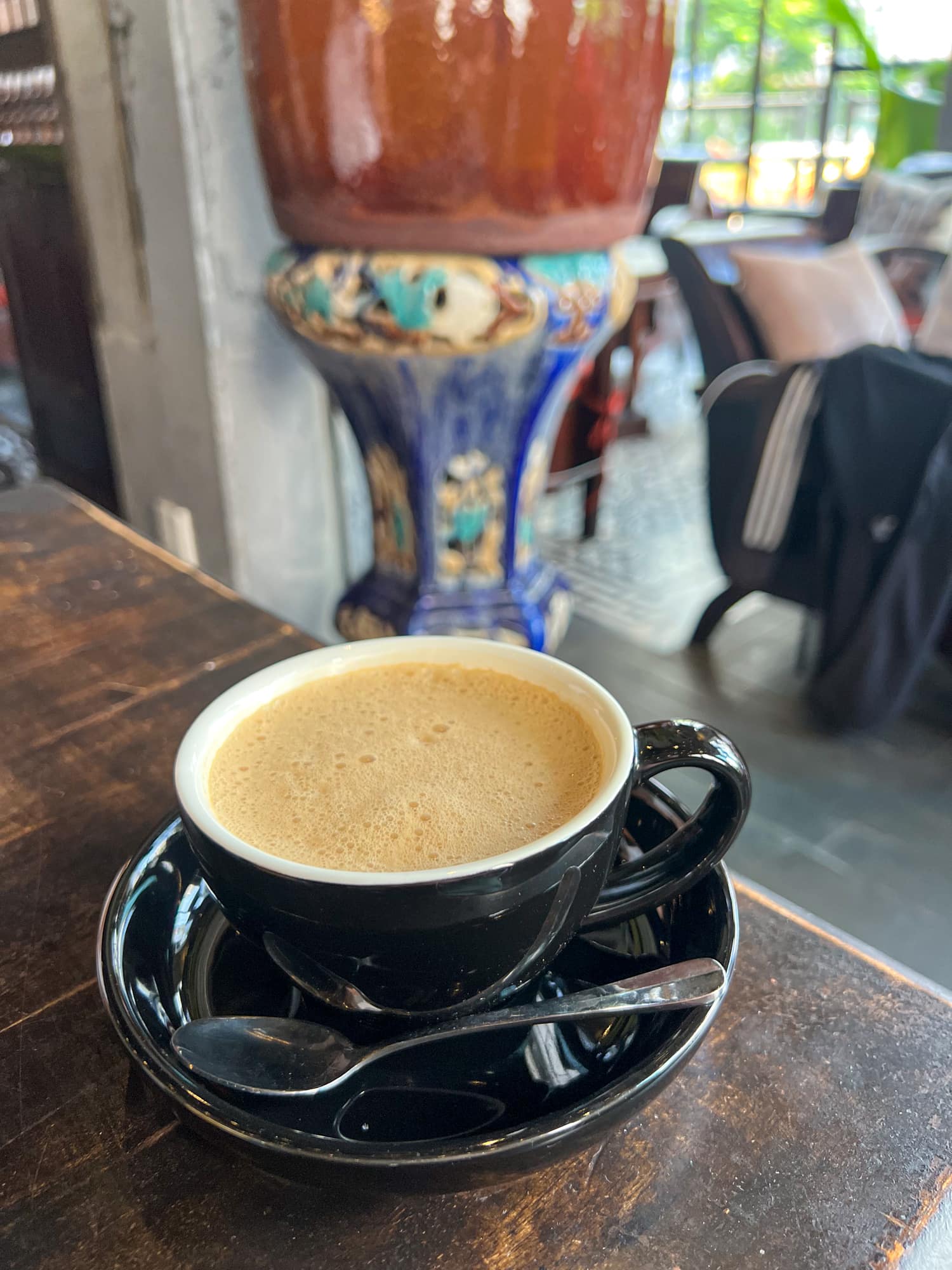 Hot Vietnamese milk coffee at Cafe Co Ba-Dong Khoi