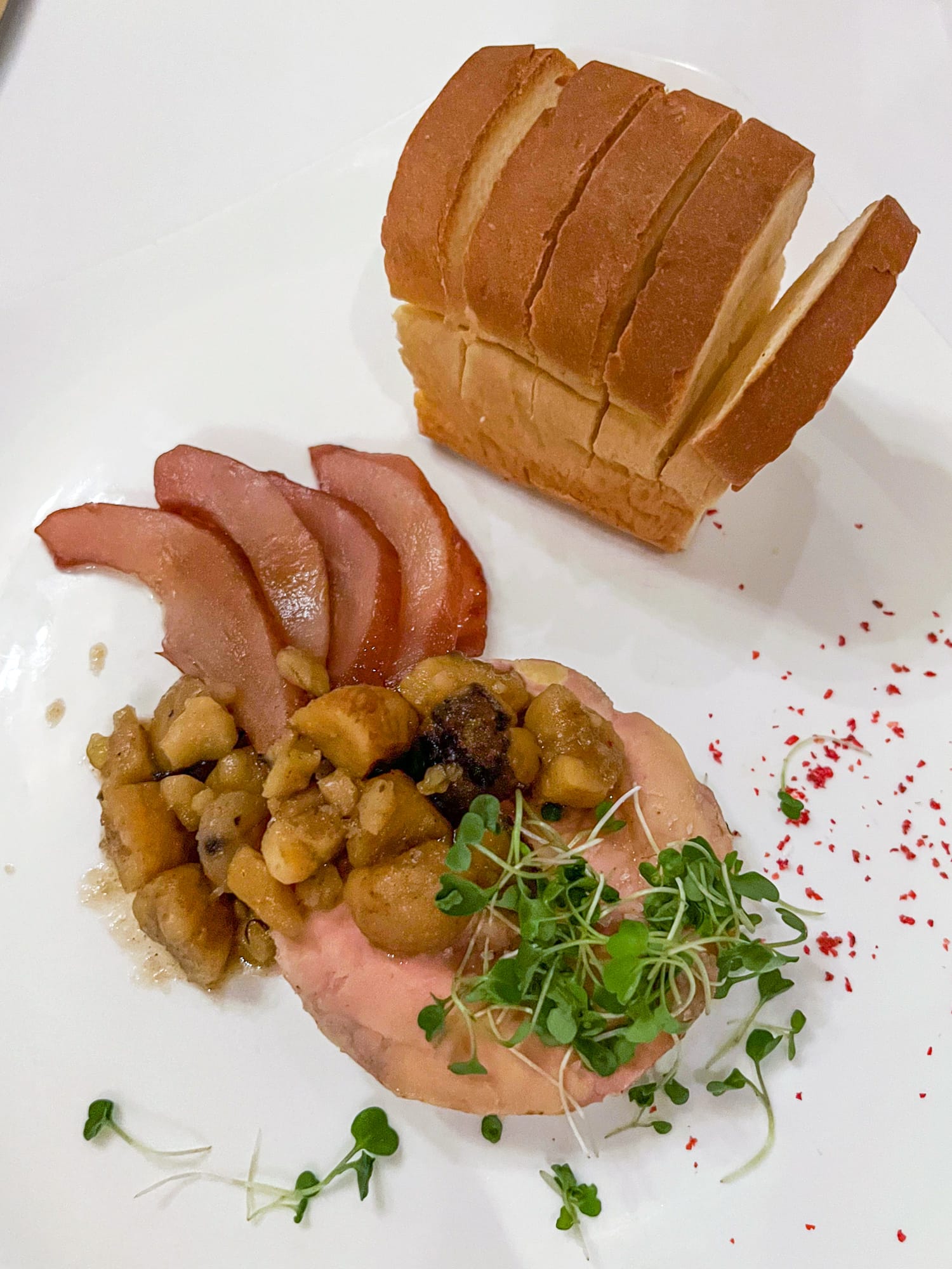 Foie gras torchon with cardamom spiced pears, chestnut marmalade, and brioche