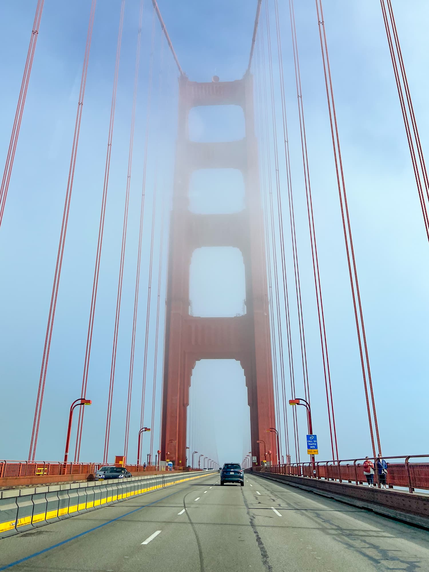 Driving across a foggy Golden Gate Bridge in San Francisco, California