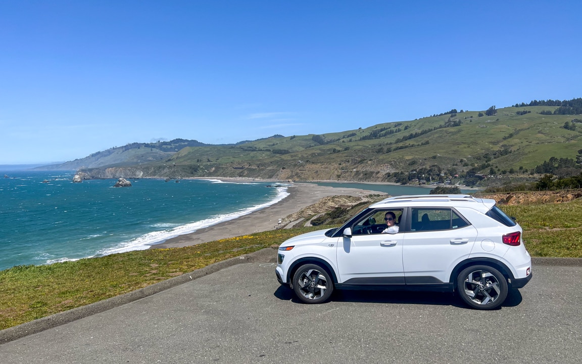 Kel in our rental car on a San Francisco to Sonoma road trip