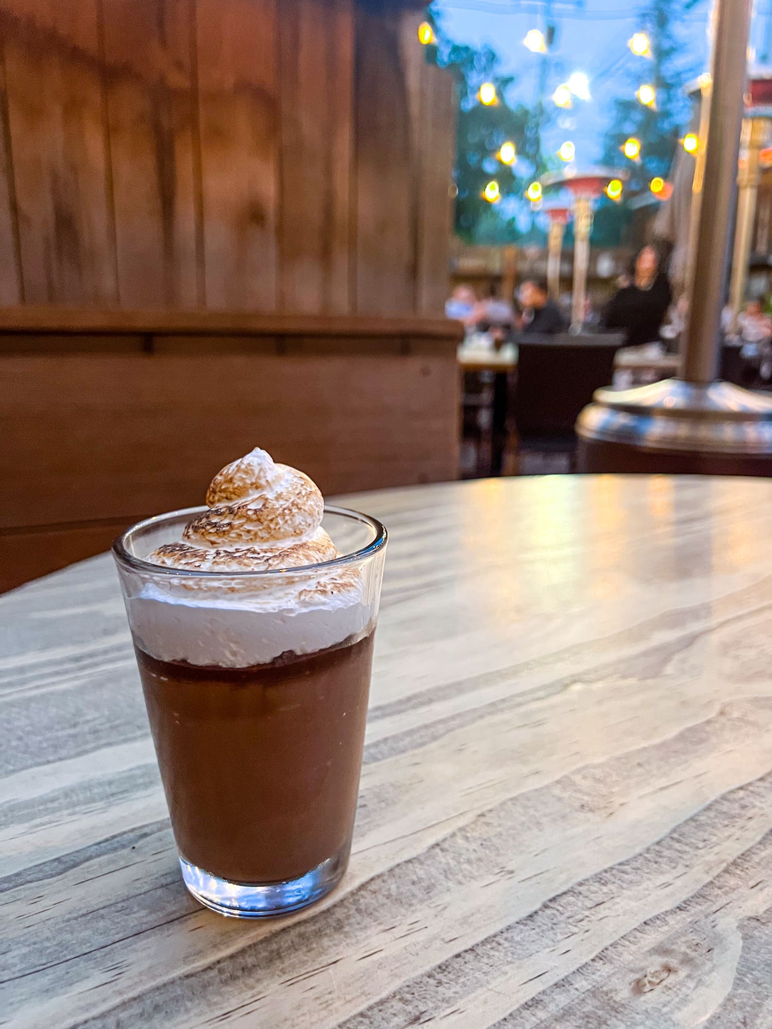 Salted fig trifle with chocolate budino, candied cocoa nibs, and Italian meringue