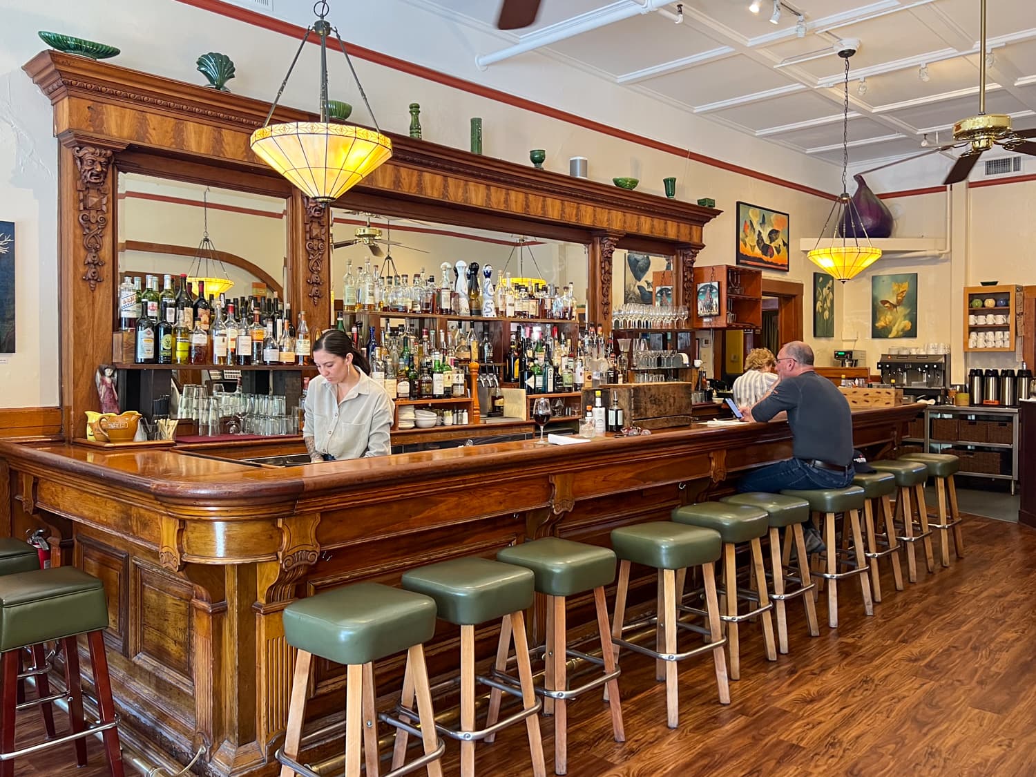 The attractive antique wood bar at girl & the fig in Sonoma Plaza