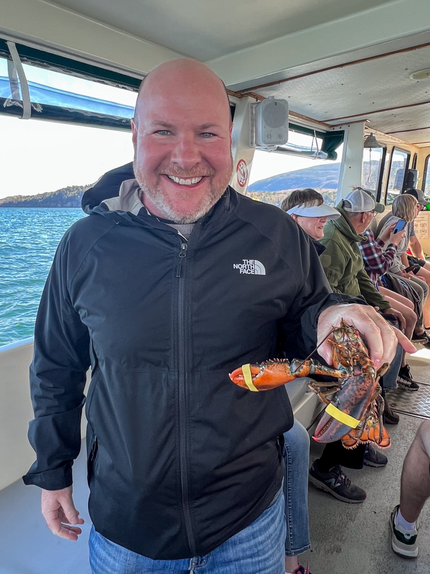 Me holding a live lobster on the Lulu lobster boat ride