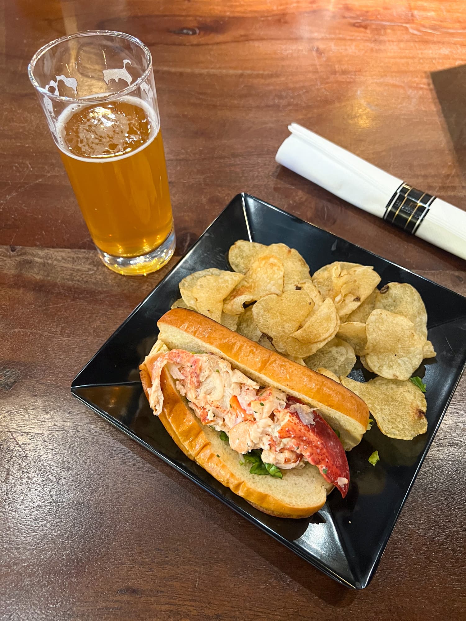 Maine lobster roll with potato chips and a Lunch IPA Beer (7%) by Maine Brewing Co. at Rigby Yard