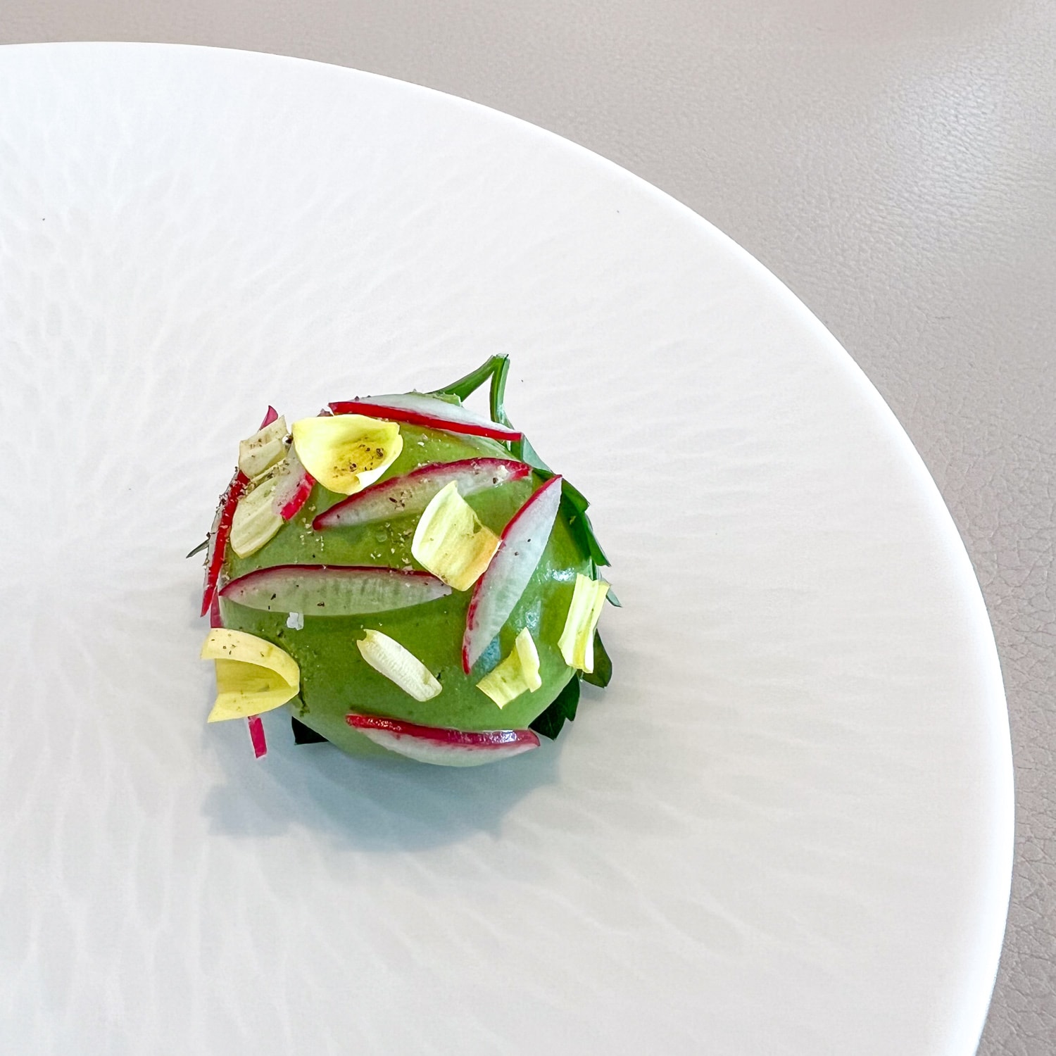 Radish canape, a signature bite from chef Daniel Calvert at Sezanne in Tokyo