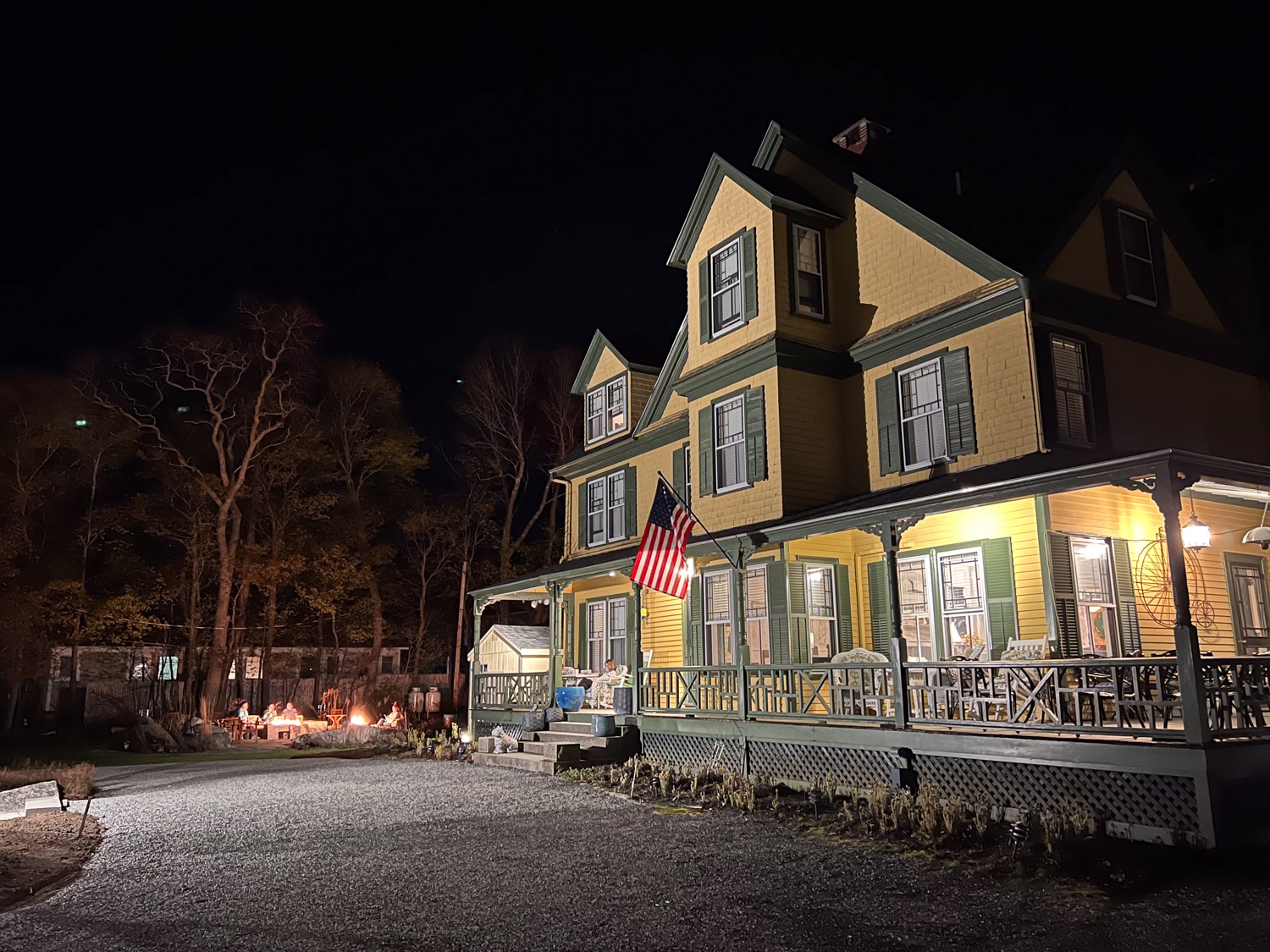 Guests enjoy the fire pit at Sand Bar Cottage Inn - Bar Harbor, Maine