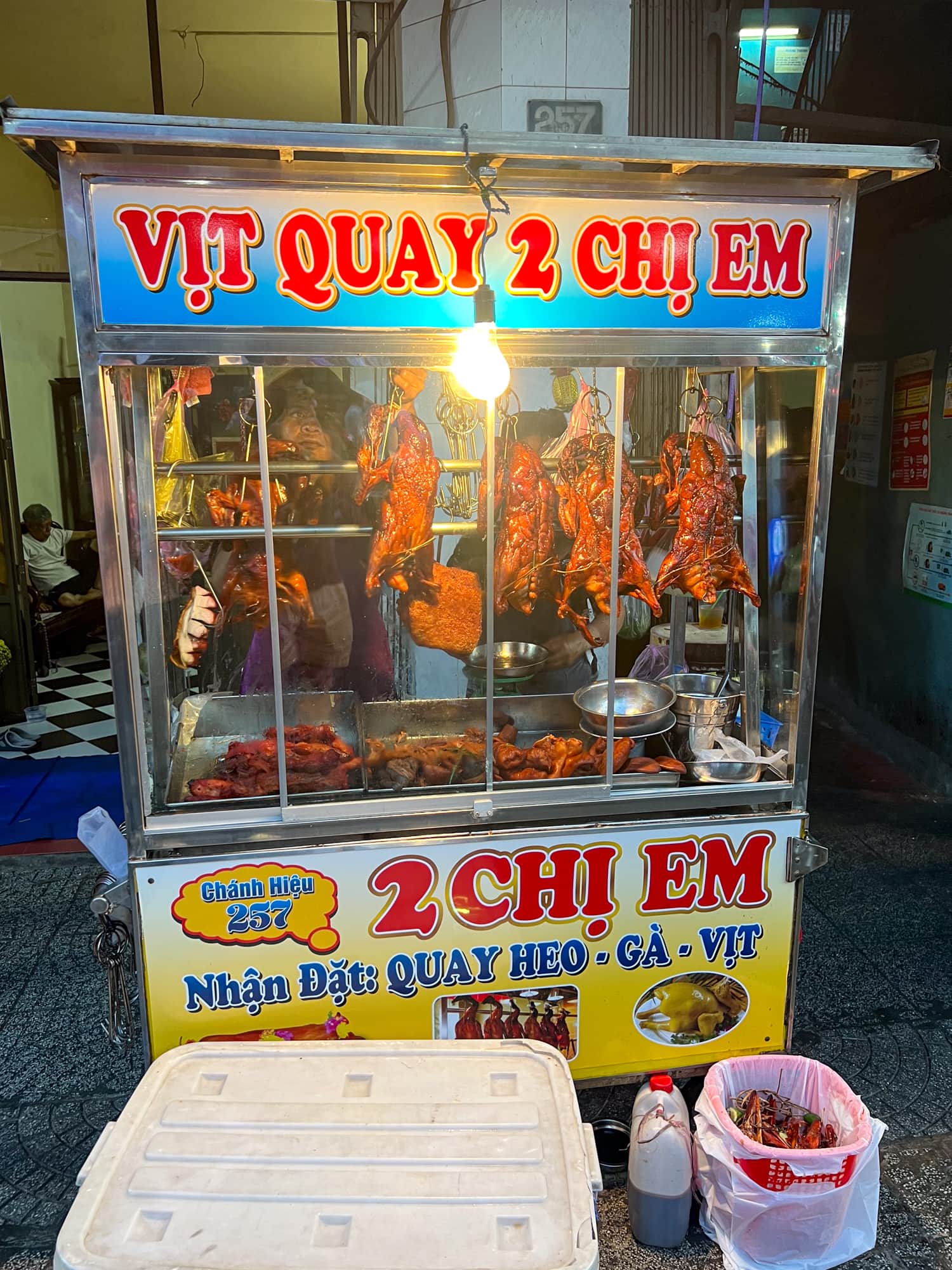 A Vietnamese street vendor selling duck