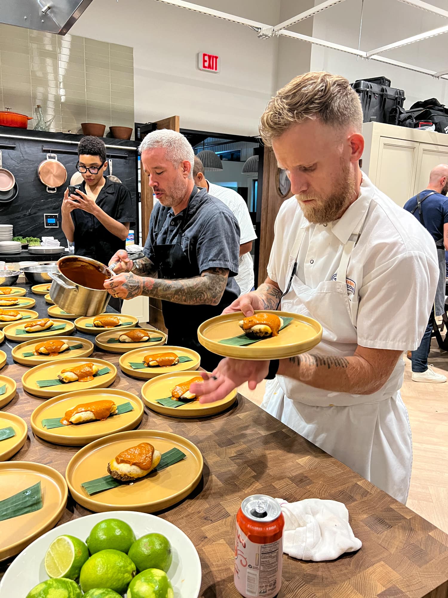 Chefs Philip Speer (left) and Dan Kennedy plating the elk tamal course.  (photo by Kelly Lemons)