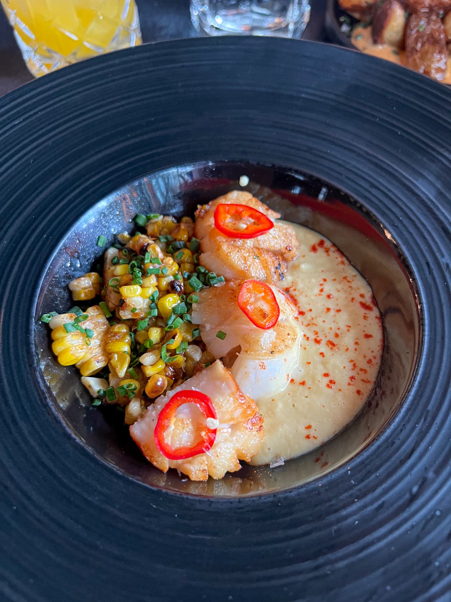 Scallops with corn two ways at Ember Kitchen in Austin, TX