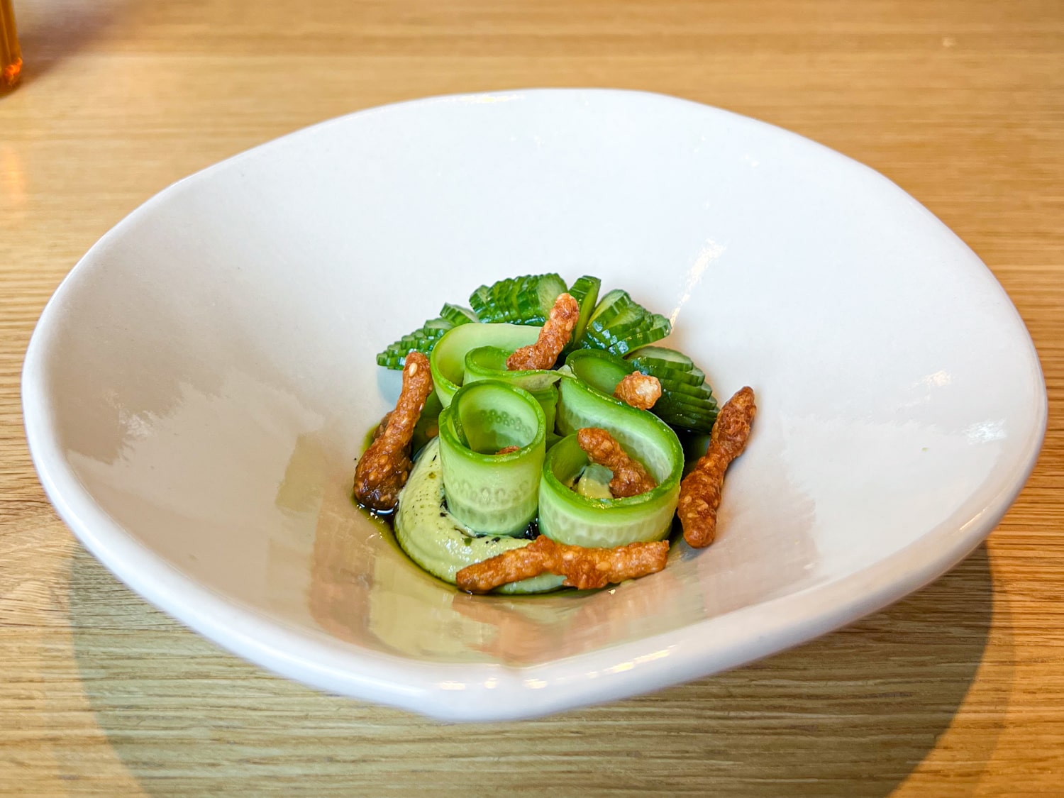 Charred cucumber with sesame and green garlic at Twelve in Portland, Maine