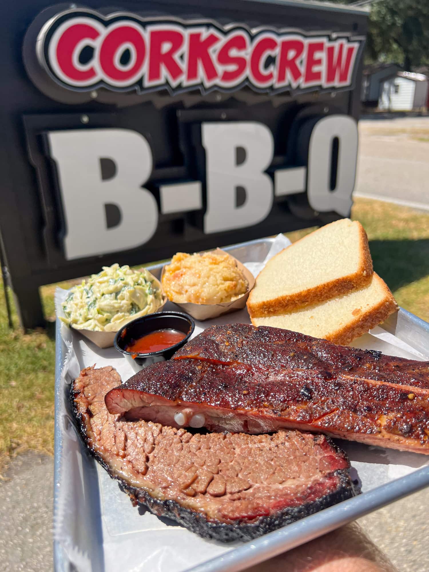 Brisket, pork ribs, and sides at Corkscrew BBQ