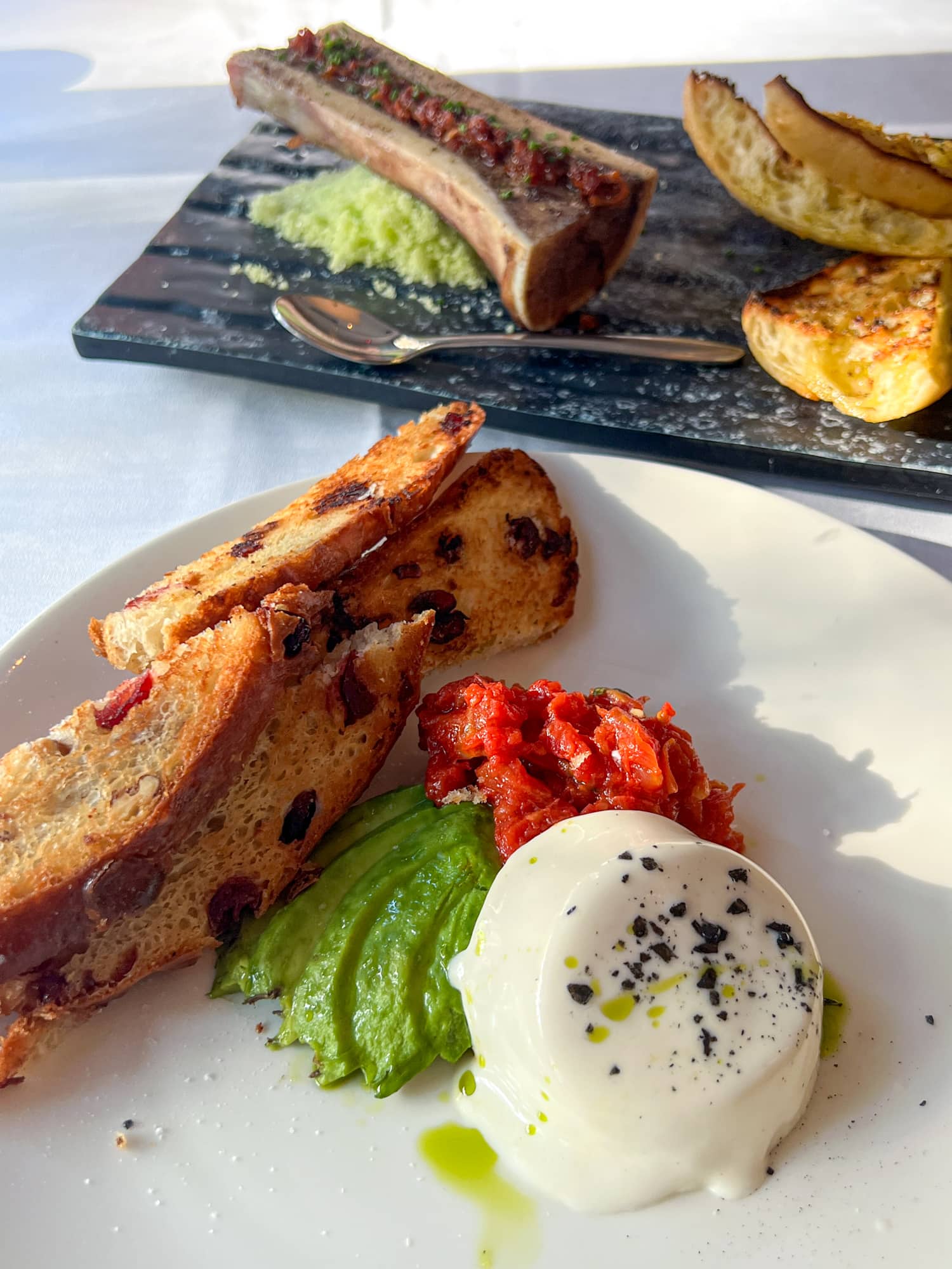 Goat cheese and bone marrow appetizers at TRIS