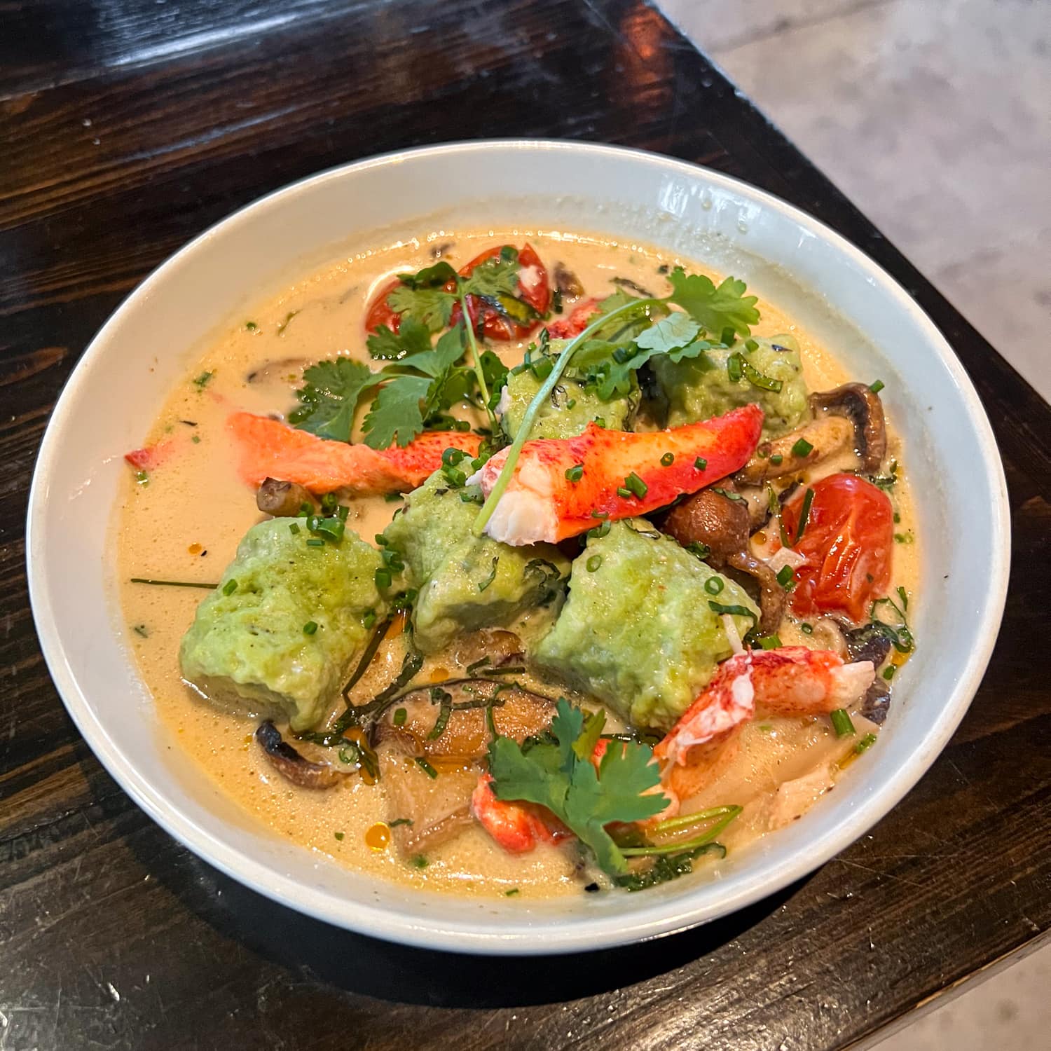 Lobster tom kha with scallion Malfatti dumplings at Maypop