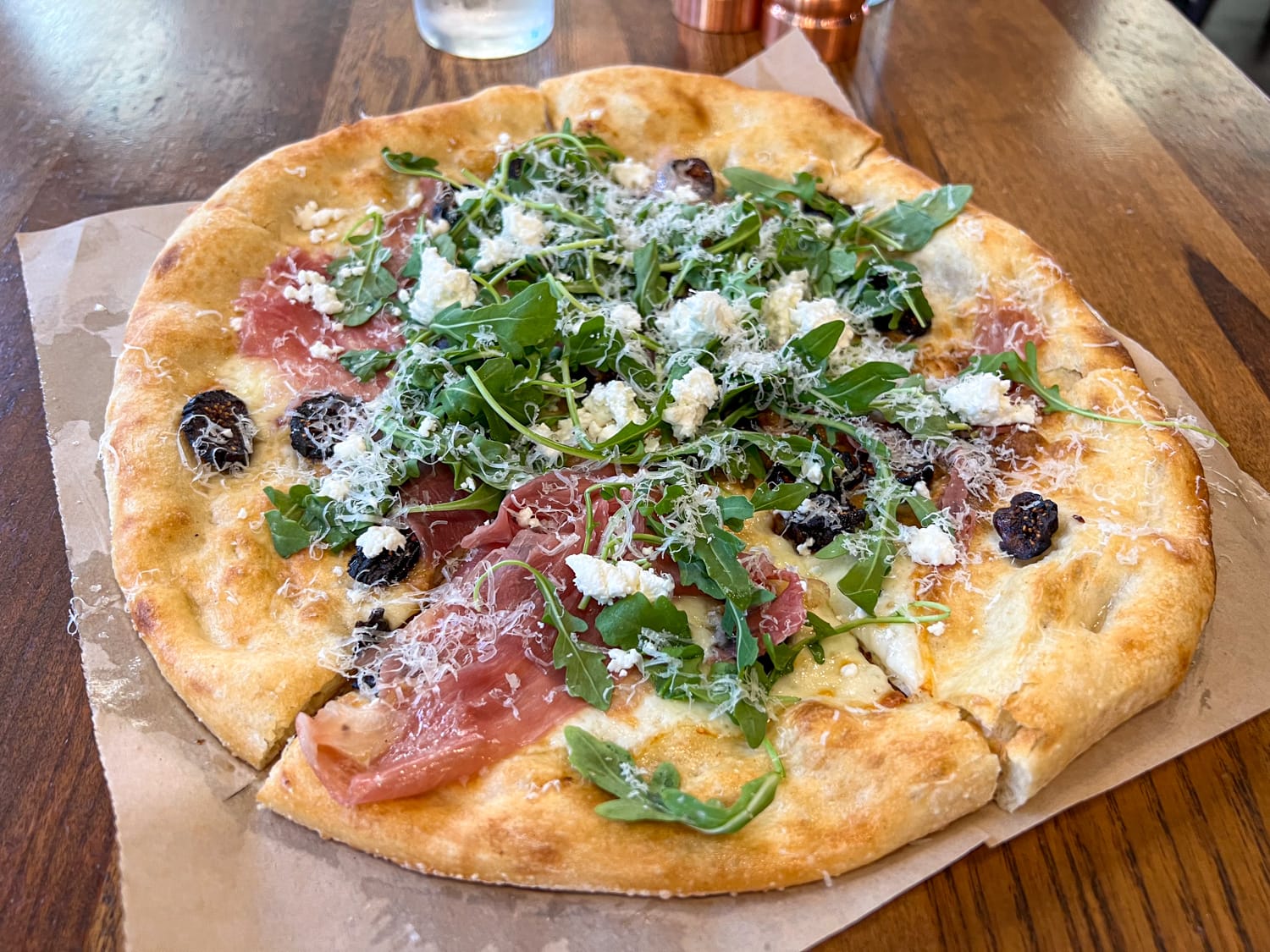 Prosciutto pizza with mission fig, goat cheese, and arugula at North Italia