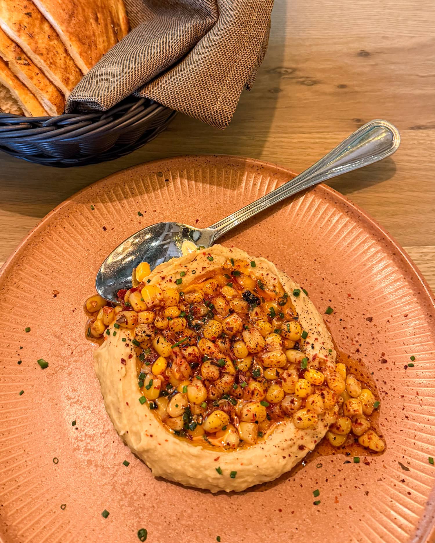 Sweet corn hummus with chili oil at Ema restaurant at The Domain in Austin, Texas