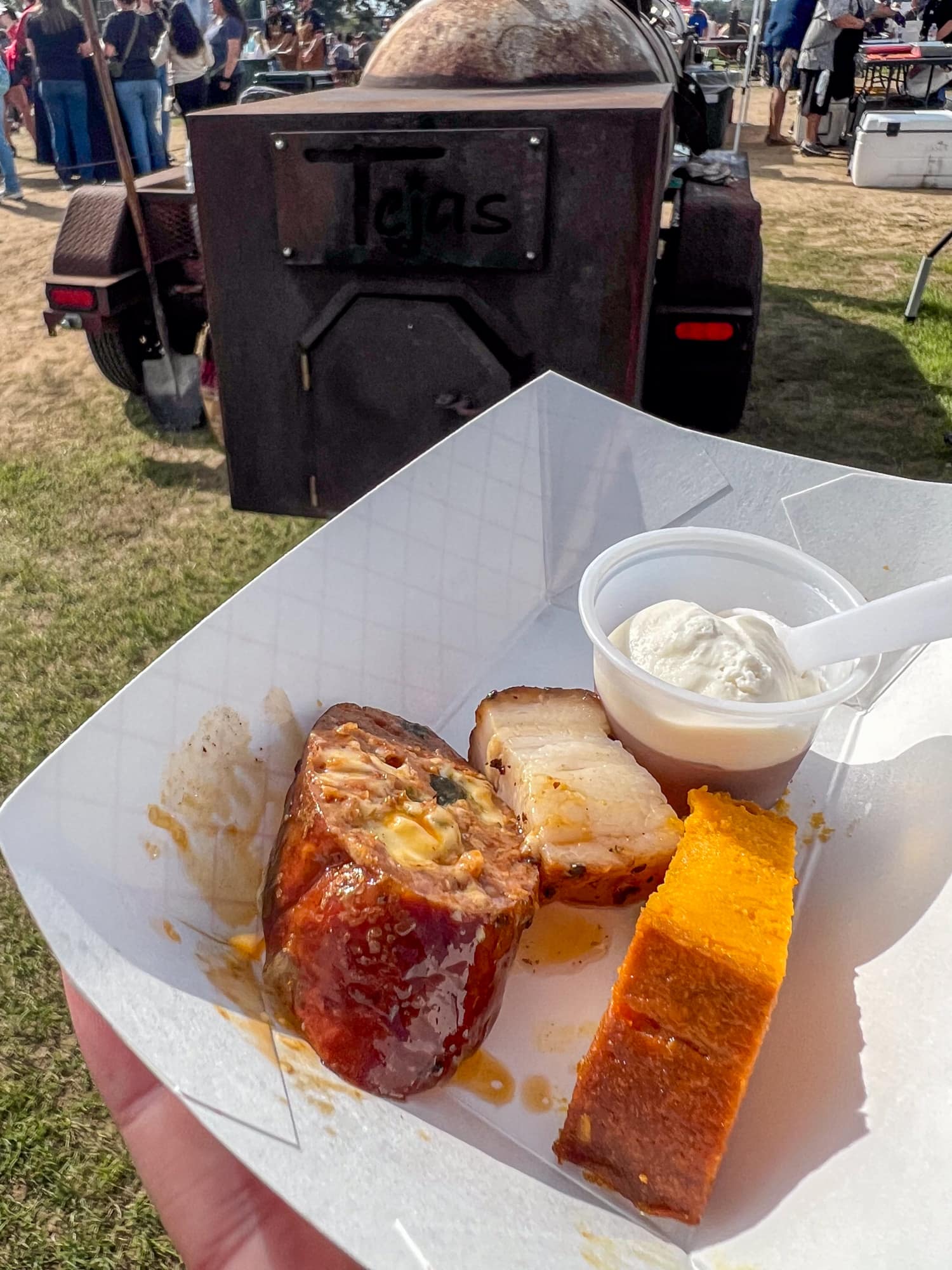 Pork belly, chile relleno sausage, carrot soufflé, and Manhattan panna cotta from Tejas Chocolate + Barbecue