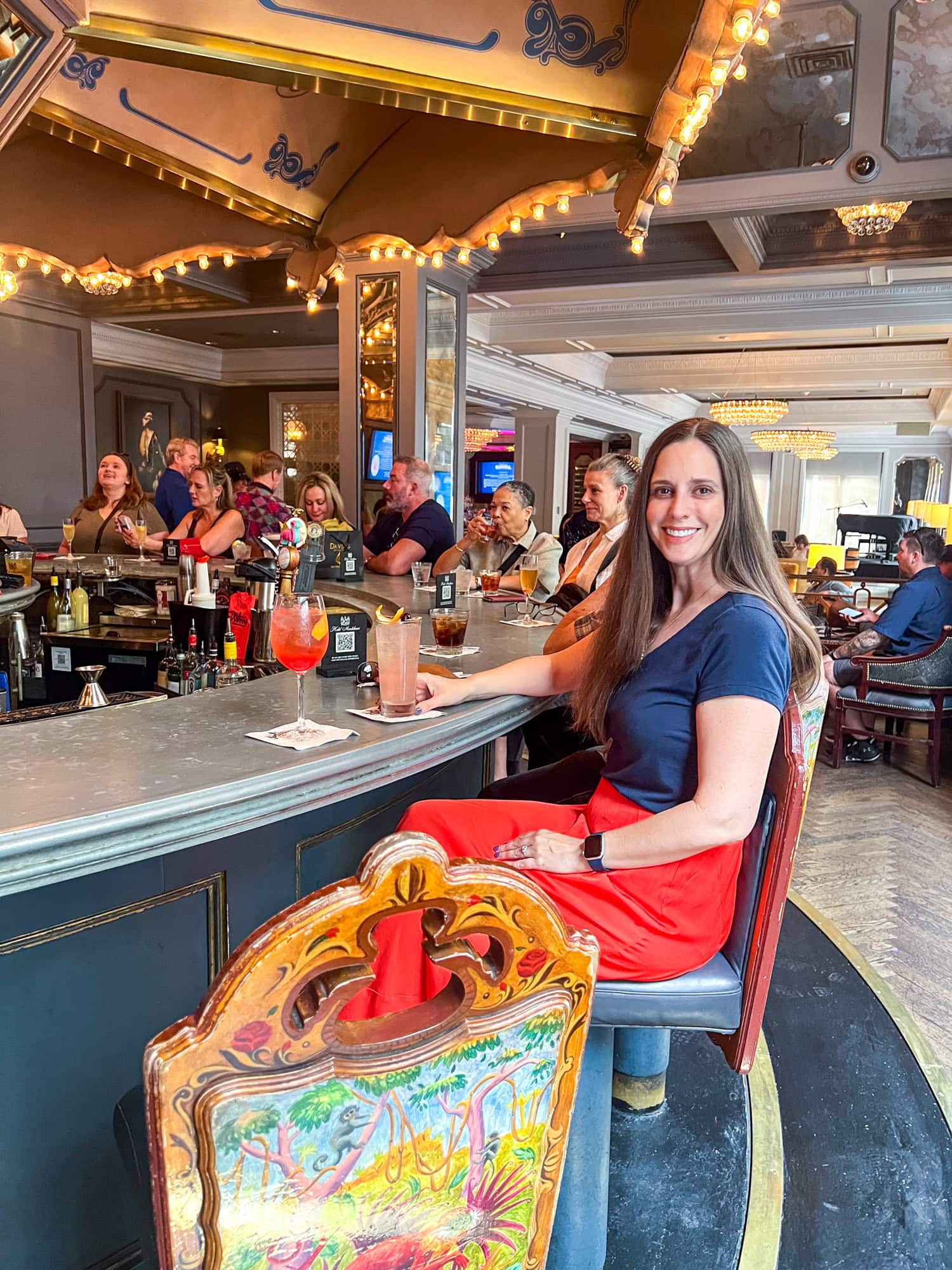 Kel is seated at the rotating Carousel Bar in the Hotel Monteleone.