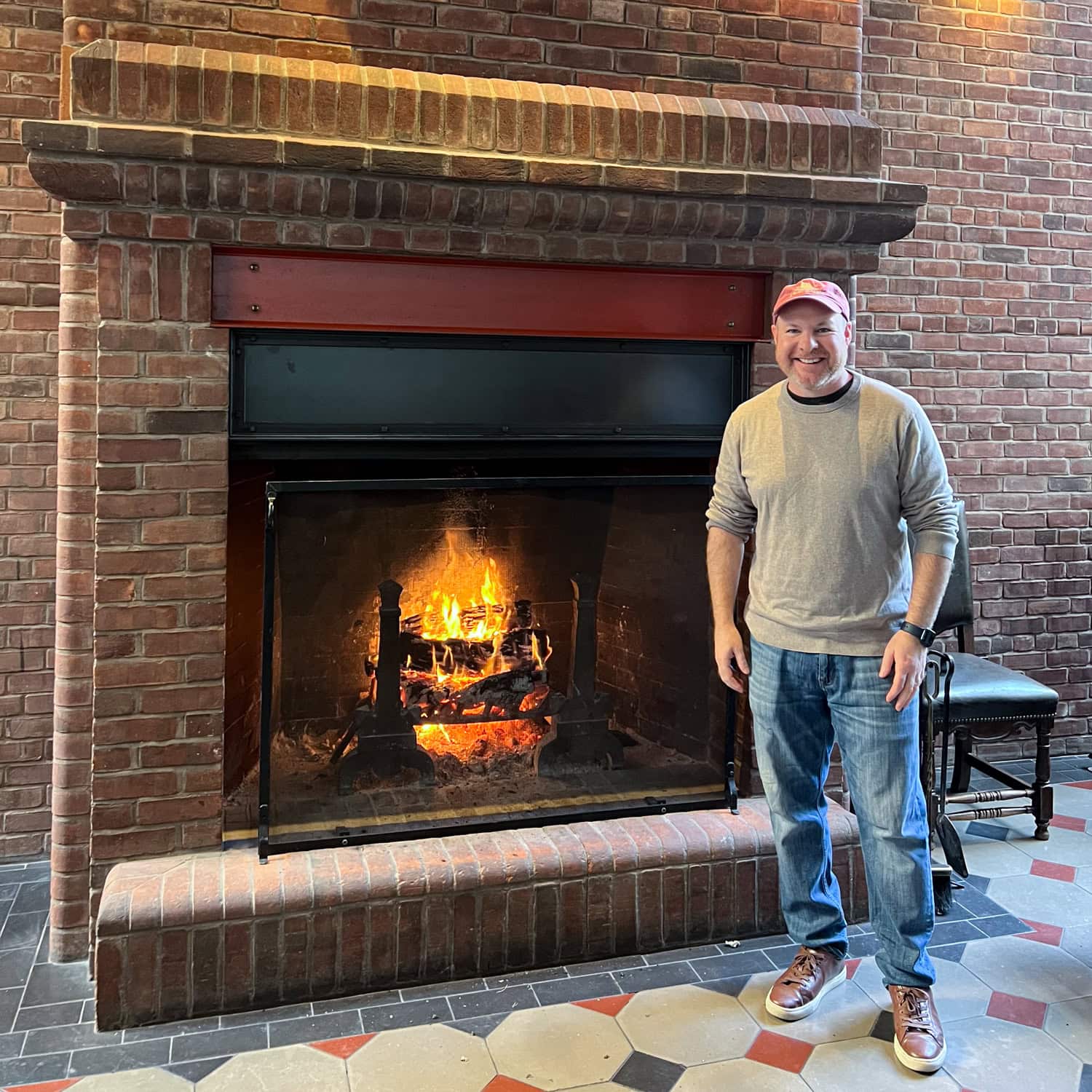 Dave enjoys the warmth of a wood fire in the lobby of Hotel Emma (photo by Kelly Lemons).
