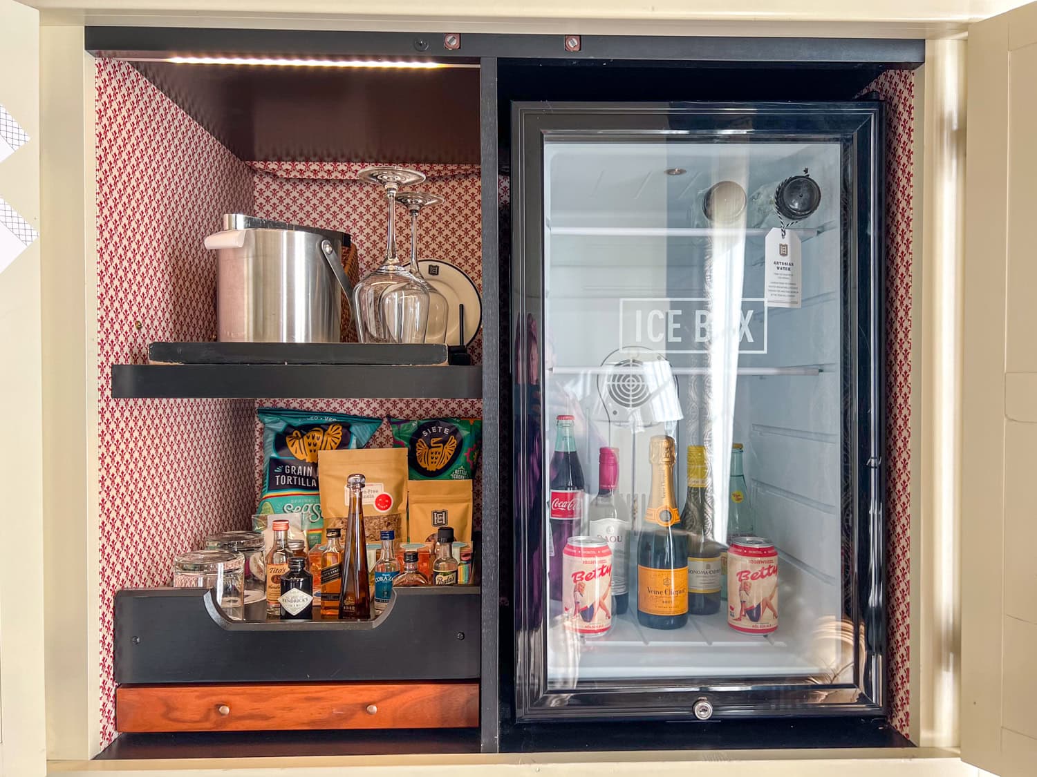 Ice Box with snacks, liquors, wine, beer, soda, and artisanal water.
