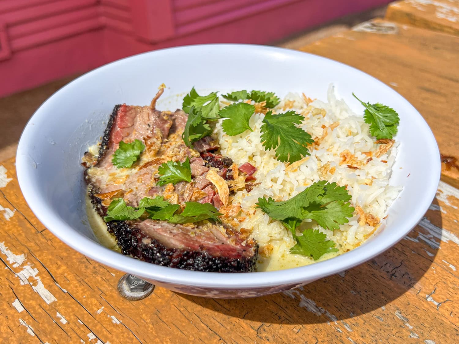 Curry Boys BBQ brisket with green curry and rice.