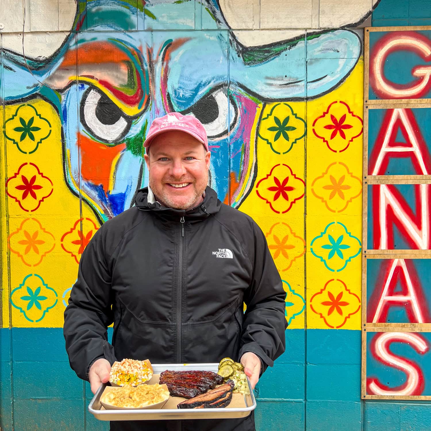 Dave holding a tray of barbecue at 2M Smokehouse in San Antonio (photo by Kelly Lemons).