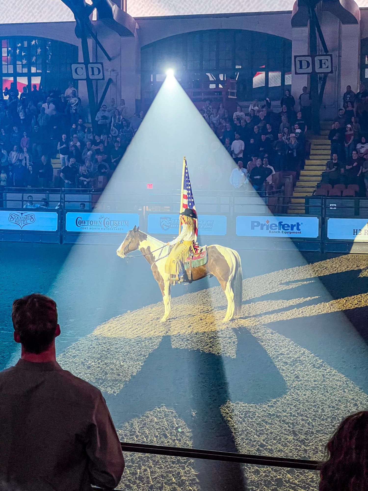 U.S. flag holder at the Stockyards Championship Rodeo.