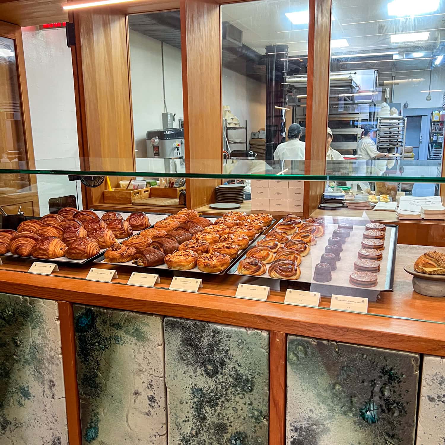 La Cabra Bakery's pastry case and kitchen.