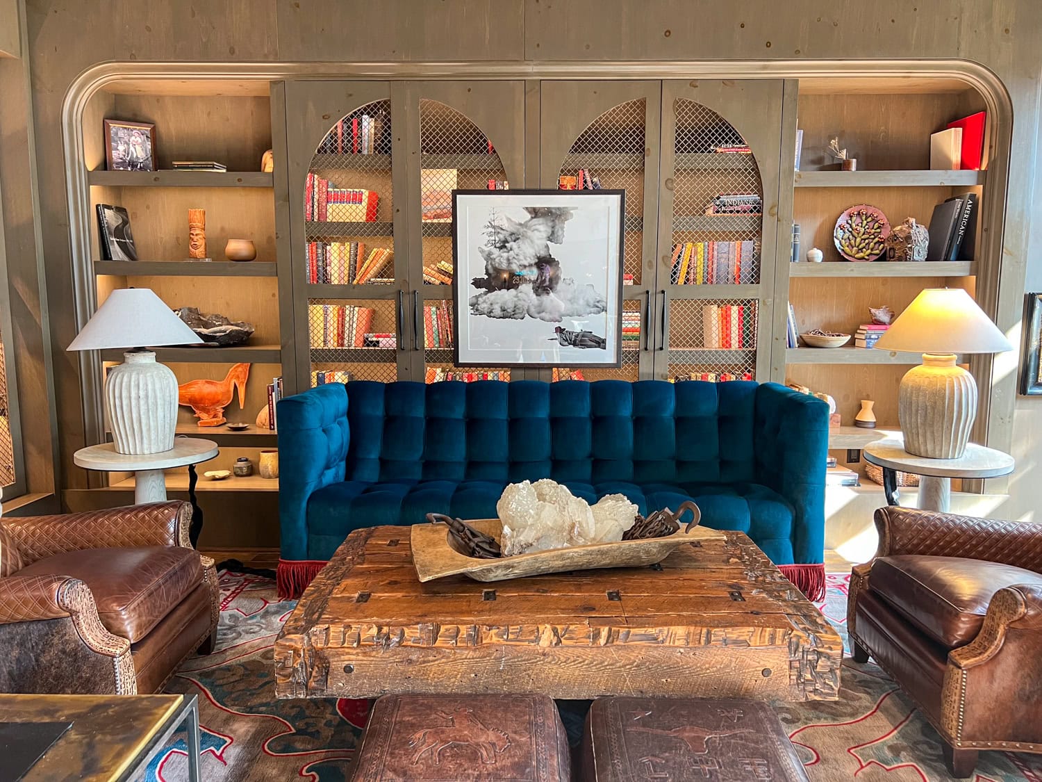 Blue sofa and bookcase at Hotel Drover.