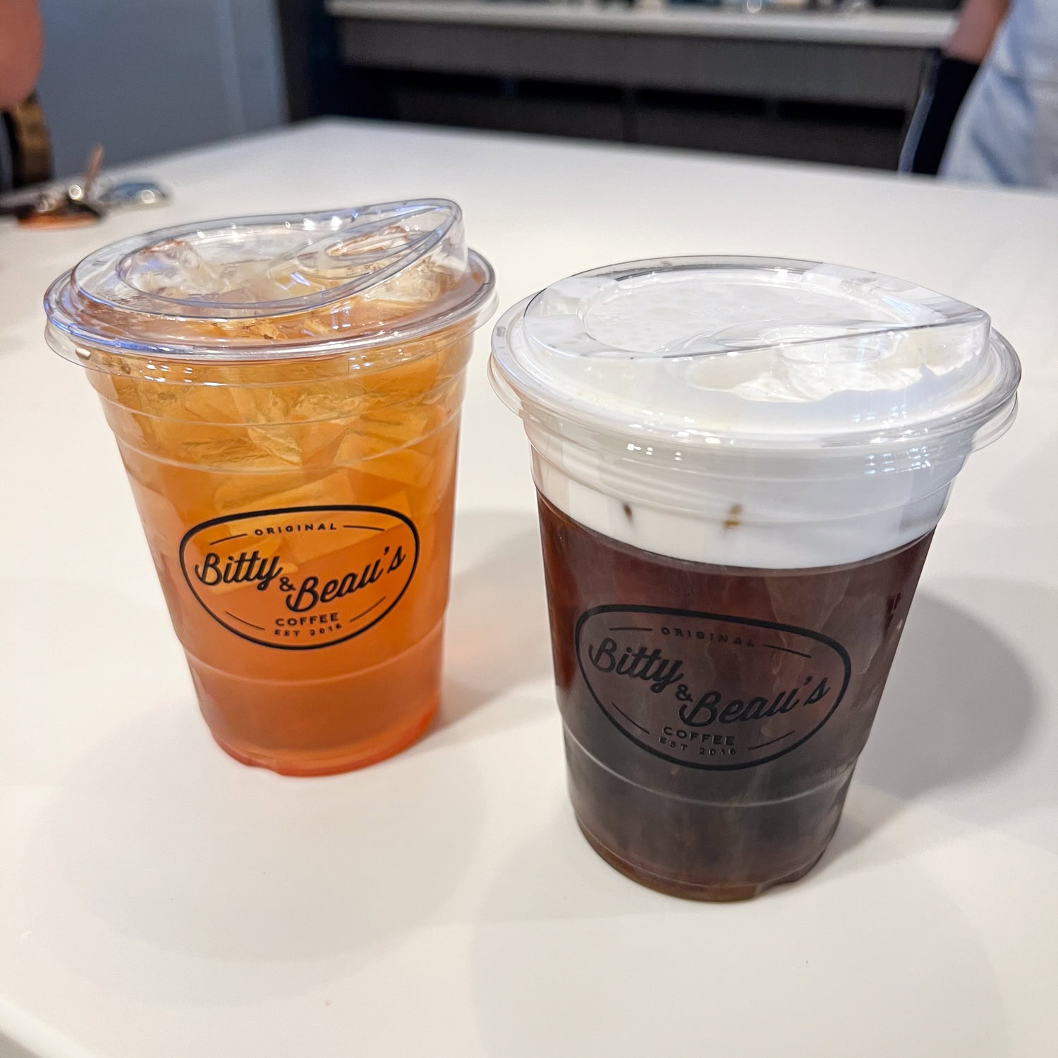 Watermelon iced tea and a cold brew with foam at Bitty and Beau's, one of the best coffee shops in Waco.
