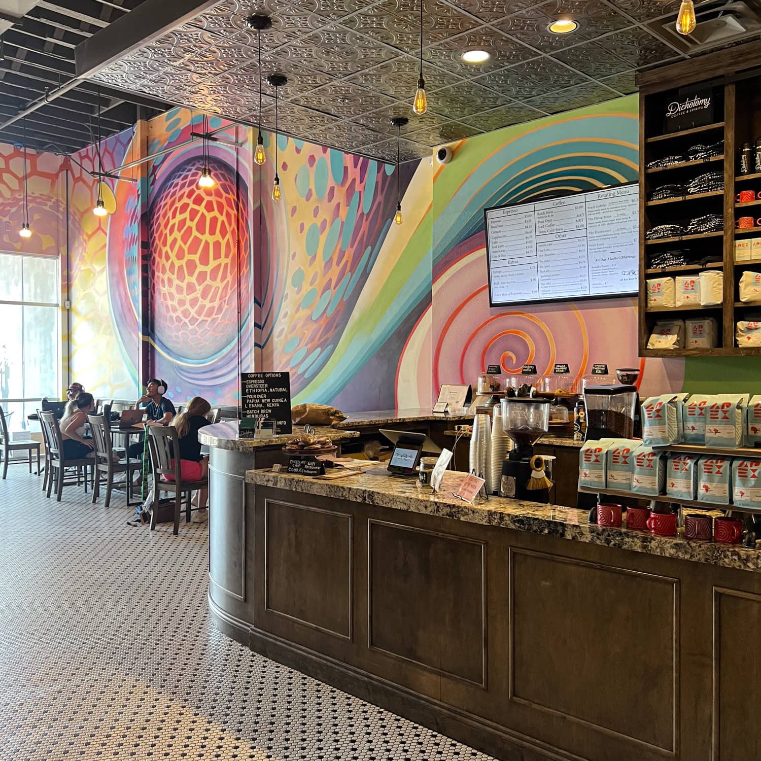 A mural by Anna Charney inside Dichotomy Coffee & Spirits in downtown Waco.