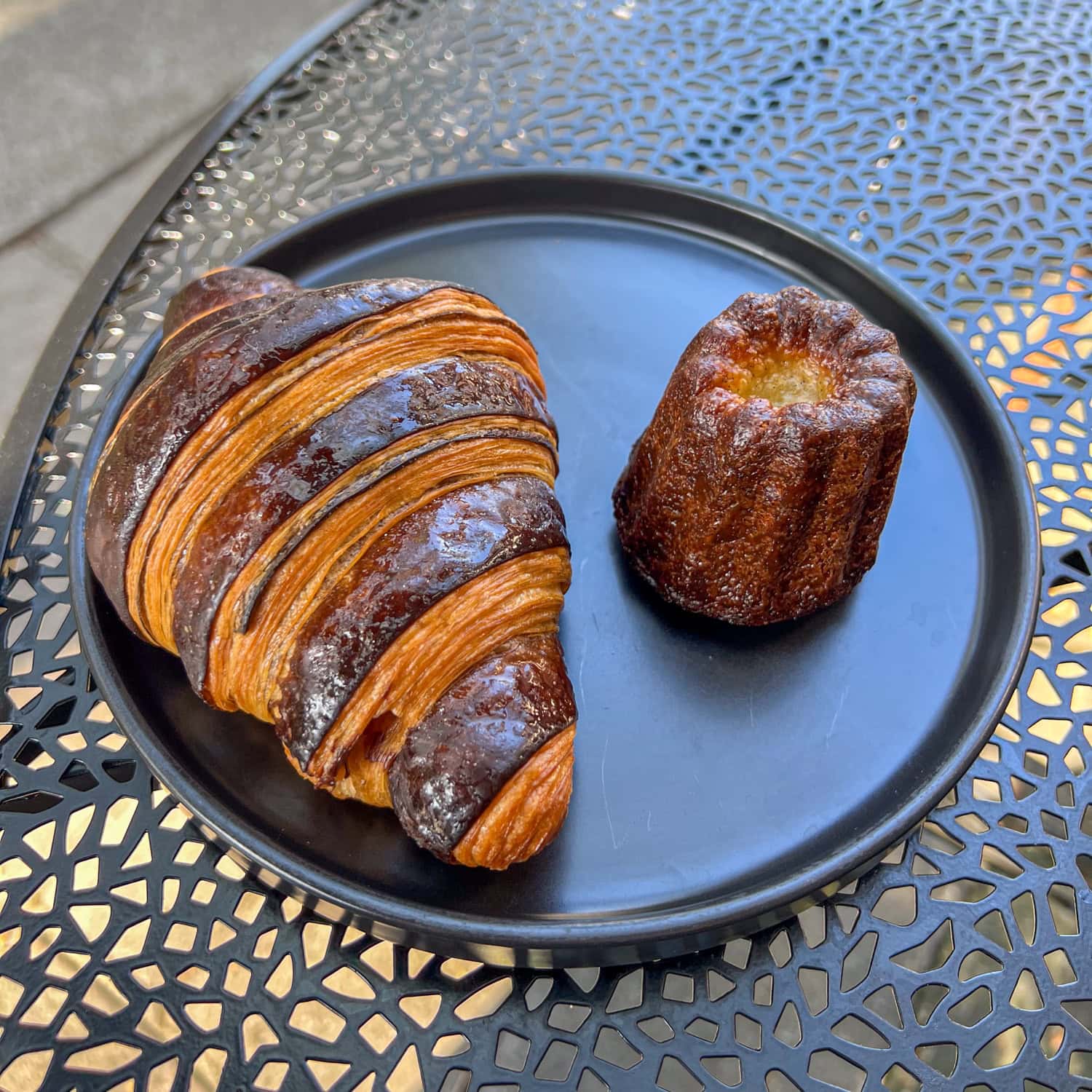 Hazelnut croissant and canele at The French Guys bakery in Seattle.
