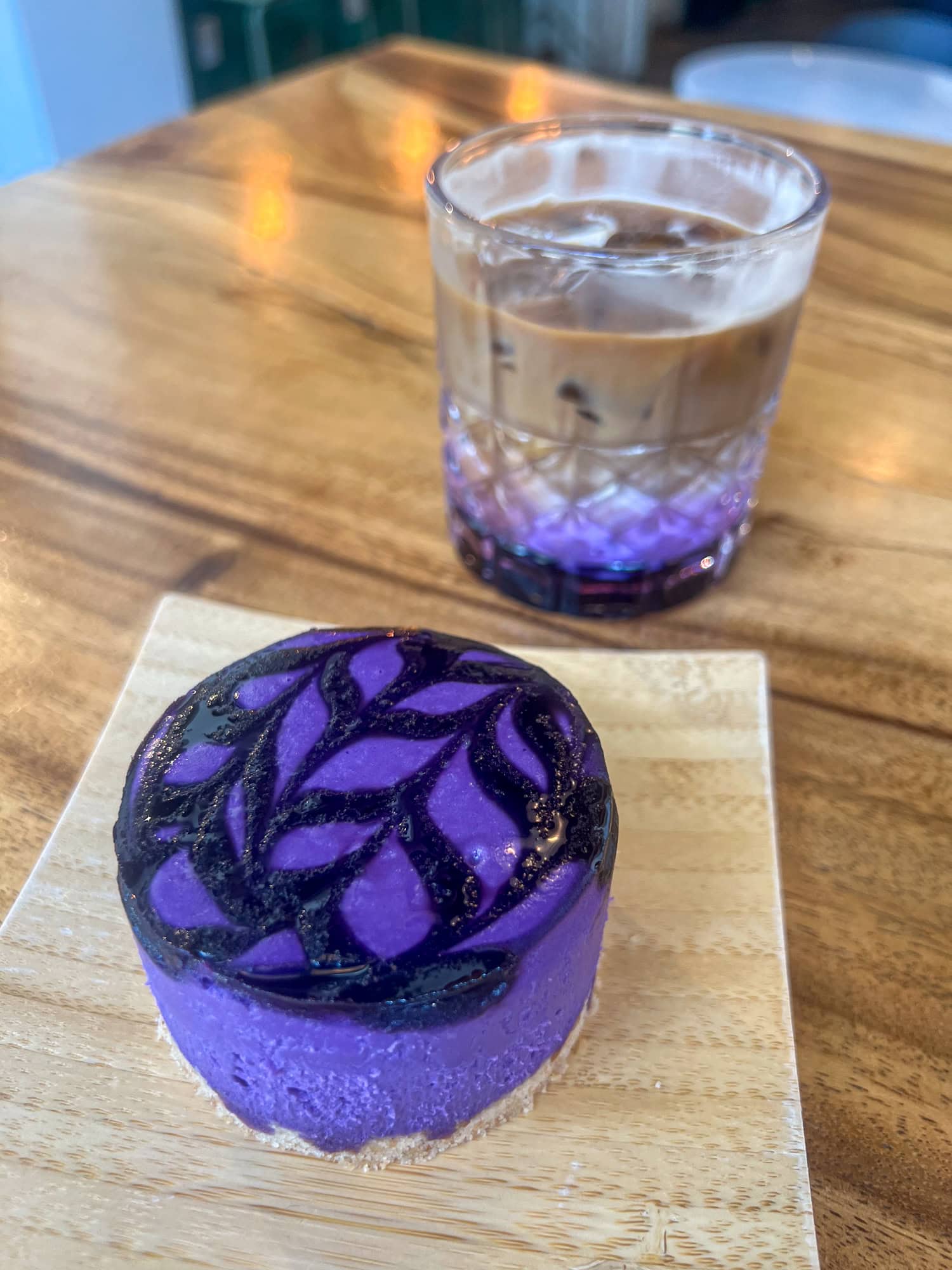 An ube cheesecake and ube latte at Hood Famous Cafe + Bar.
