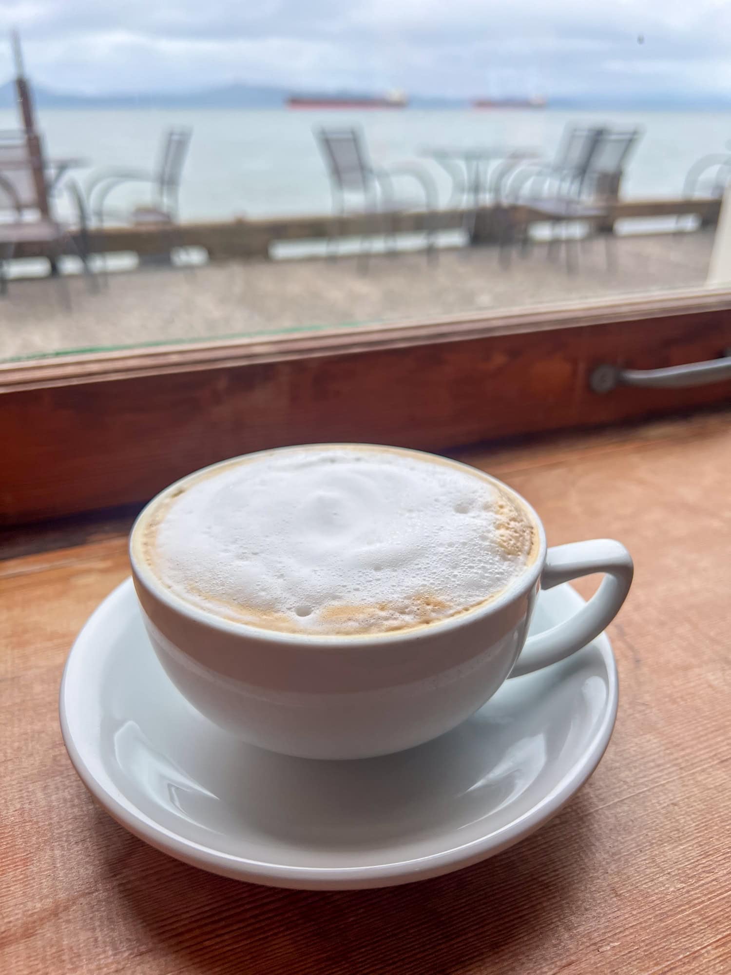Cappuccino with a view of the Columbia River at Coffee Girl in Astoria, OR.