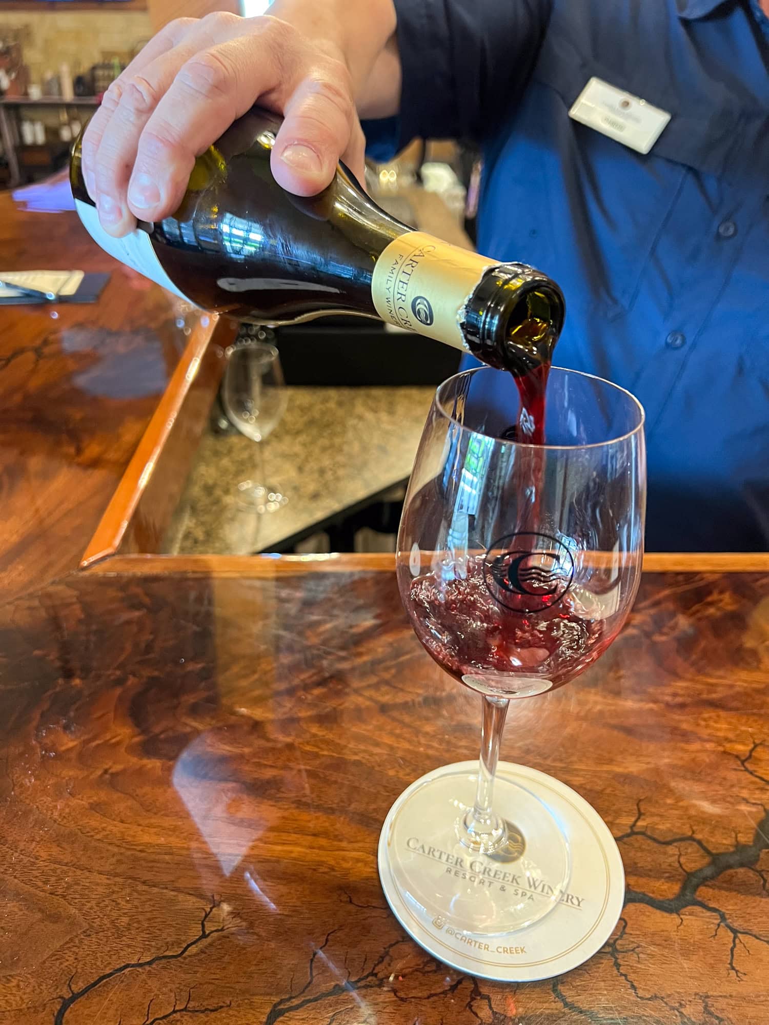 Pouring a glass of the Maverick at Carter Creek Winery.