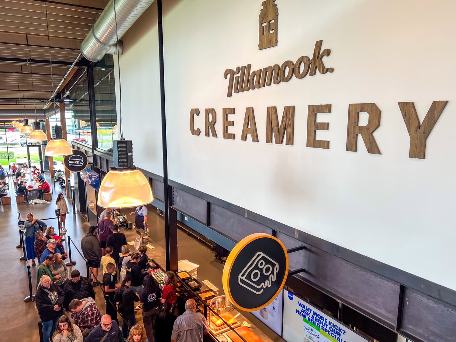 Customers wait in line to order lunch at Tillamook Creamery.