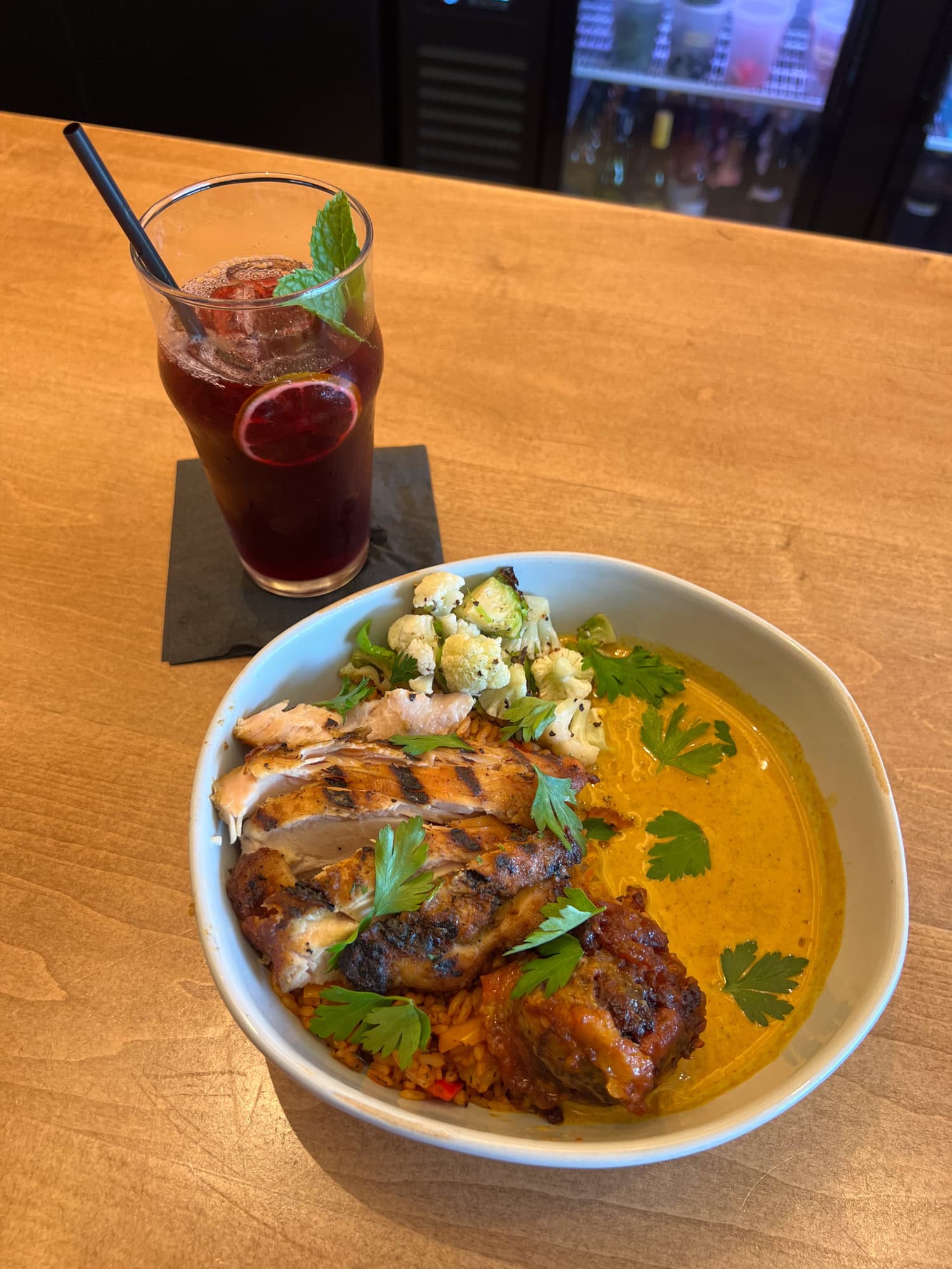 Smokey Jollof jambalaya, motherland curry, and chicken at ChòpnBlok.