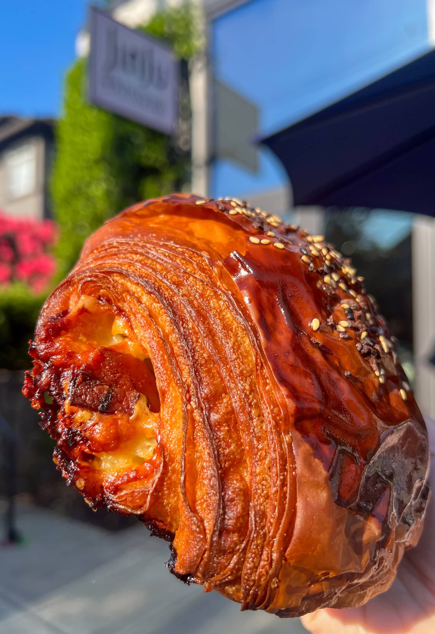 Ham, bacon, and Gruyère croissant from JinJu Patisserie, a 2025 James Beard Award finalist in Portland, Oregon.