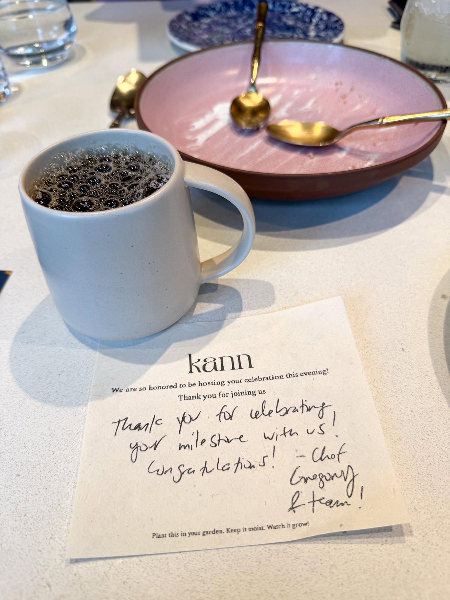 Kann coffee with a "happy birthday" note from Chef-owner Gregory Gourdet.