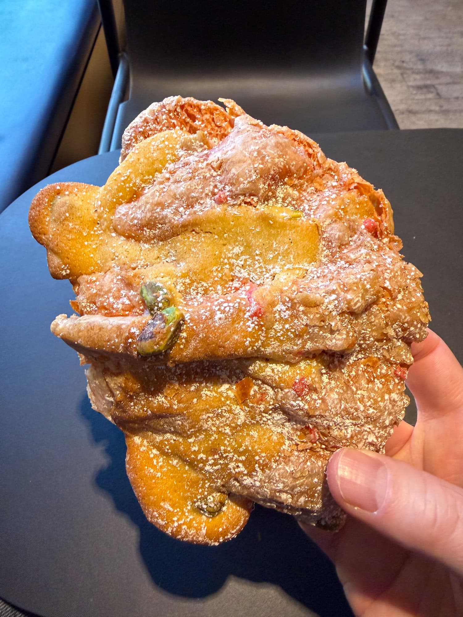 Pistachio rose croissant at Nuvrei, a top bakery in Portland, OR.